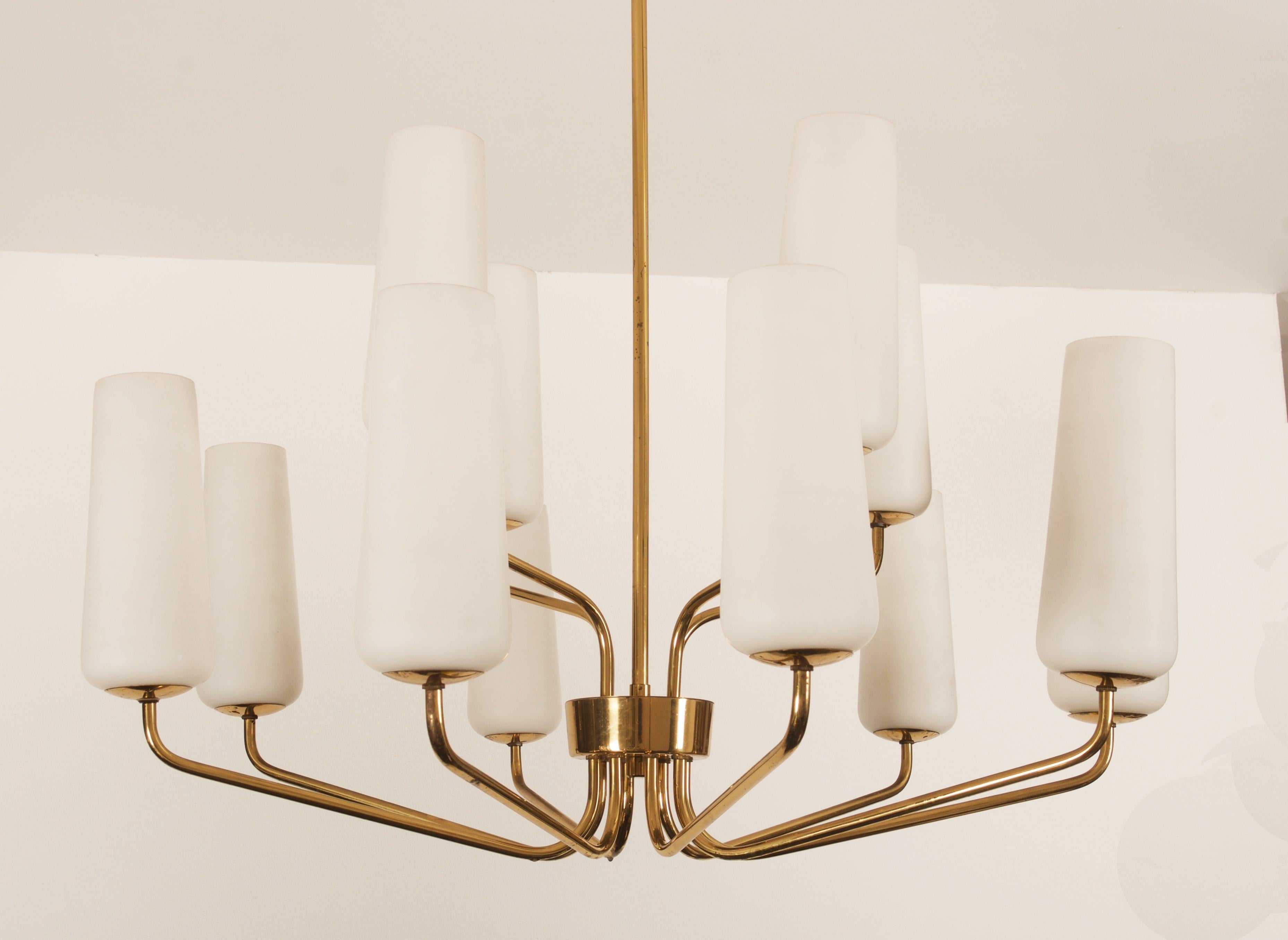 Brass construction with twelve arms and opaline glass shades each fitted with E14 sockets. Made in Vienna by Rupert Nikoll in the early 1950s.
Total height can be customized.
Up to 2 pieces available price per lamp.