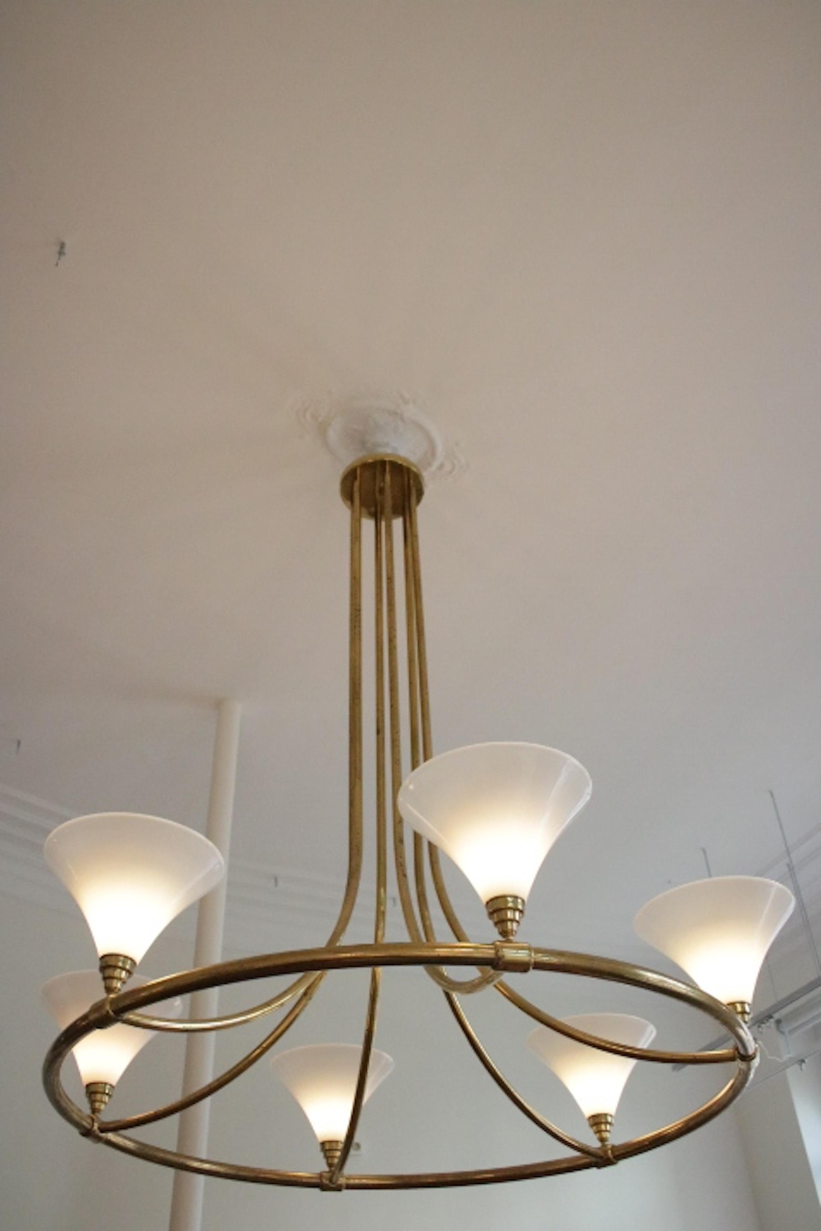 An extra large large ( two meters high), rare and very impressive Mid-Century Chandelier, probably from a luxurious hotel in Viena. Brass frame and six opaline shades.Very good condition.The frame shows wear consistent with time and use ,but
