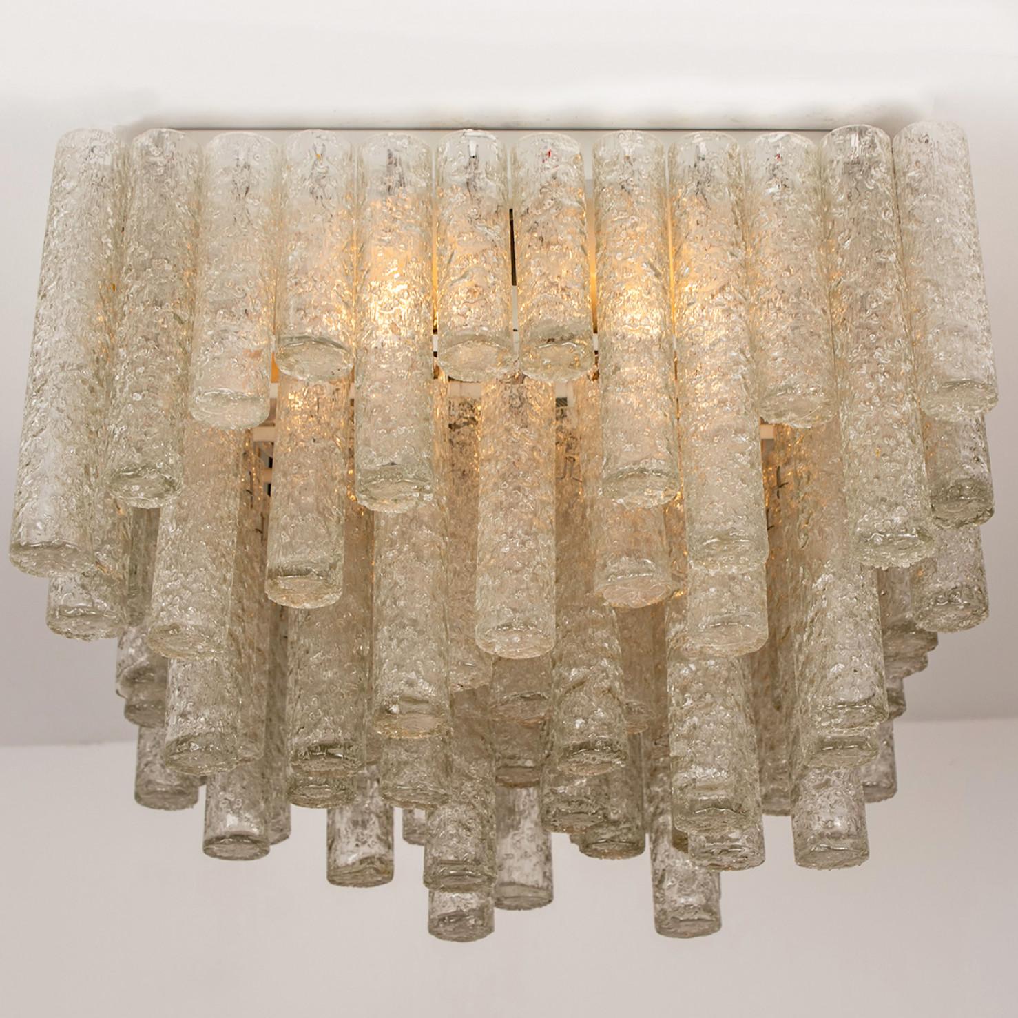 This huge beautiful square flush mount was manufactured by Doria in Germany in the 1960s. It consists 96 several organic glass tubes of different lengths. This huge square flush mount is very unique and rare to find.

Two items in stock. To build