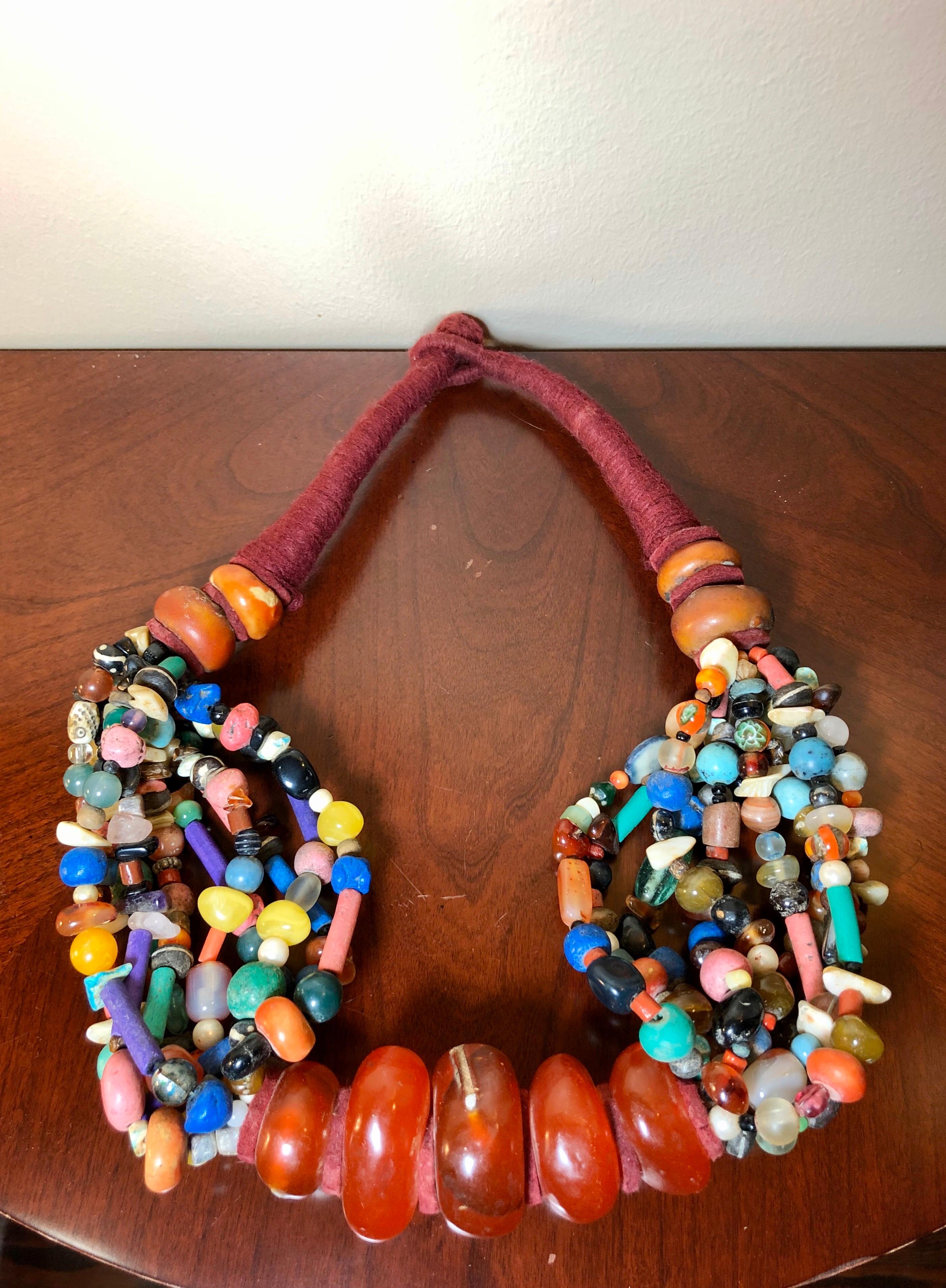 This ostentatious Moroccan Copal beaded necklace glows as if lit from within. The amber copal is magical, with greater transparency than commonly found copal. Made in Zagora, Morocco, in the late 1970s-early 1980s, this necklace has many
