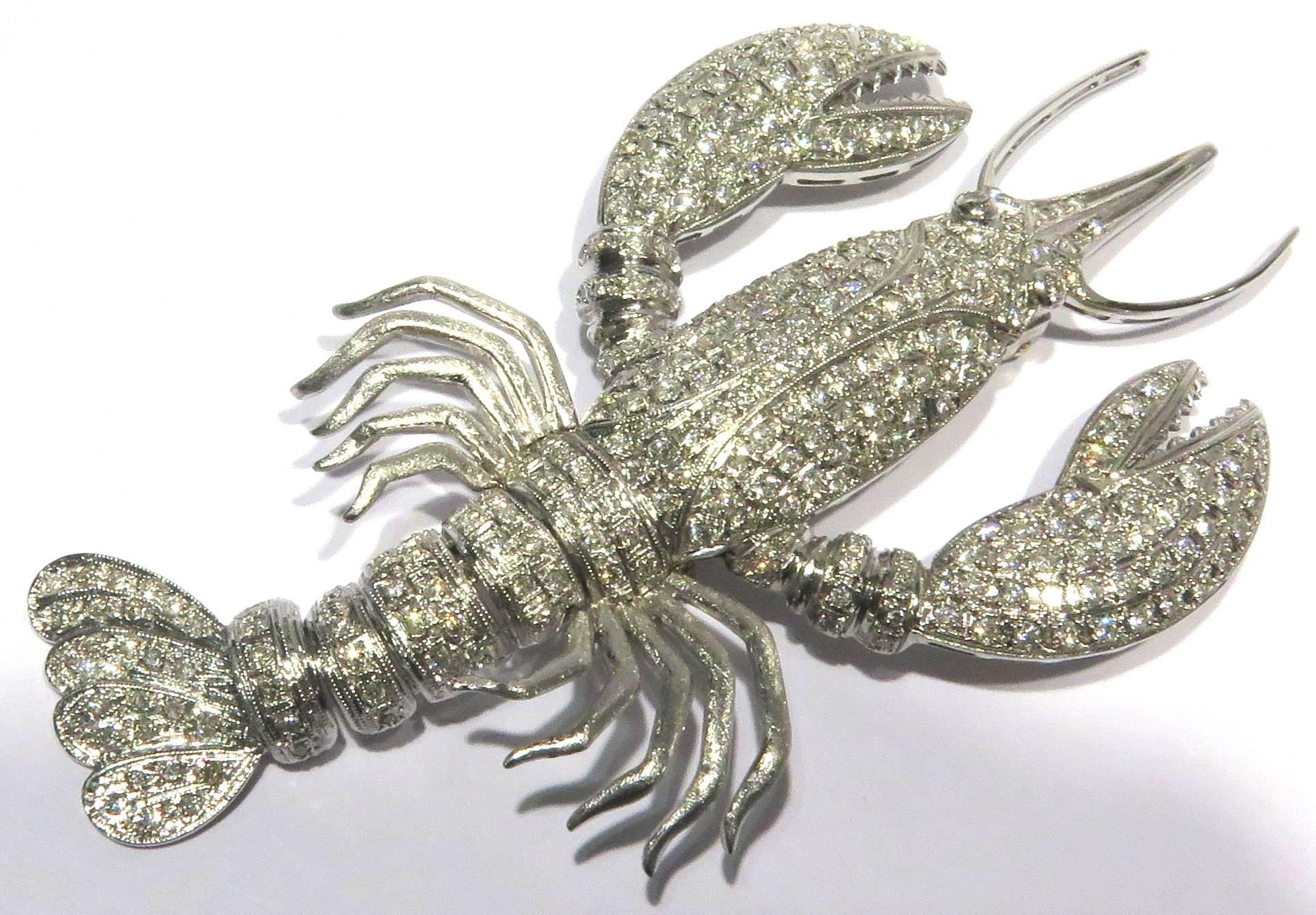 This mega adorable 14k white gold diamond lobster pin looks good enough to eat! His tail is flexible and moves in a very realistic natural way. His body has all pave' prong set diamonds. There are approximately 2.35 ct diamonds.
This lobster pin