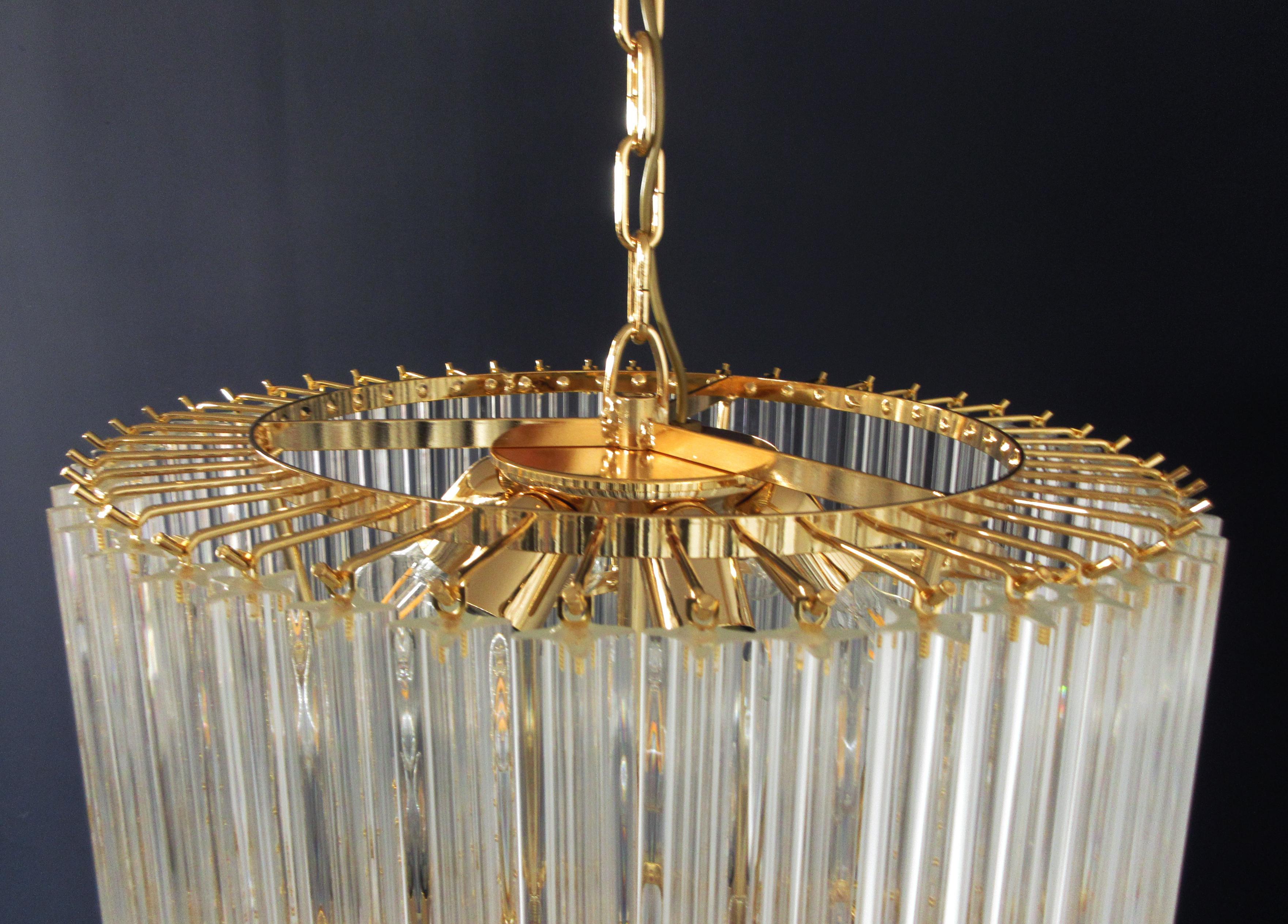 Fantastic vintage Murano chandelier made by 166 Murano crystal trasparent prism in a gold metal frame. The shape of this chandelier is spiral.
Period: 	late XX century
Dimensions: 88,60 inches height (225 cm) with chain; 57,10 inches height (145 cm)