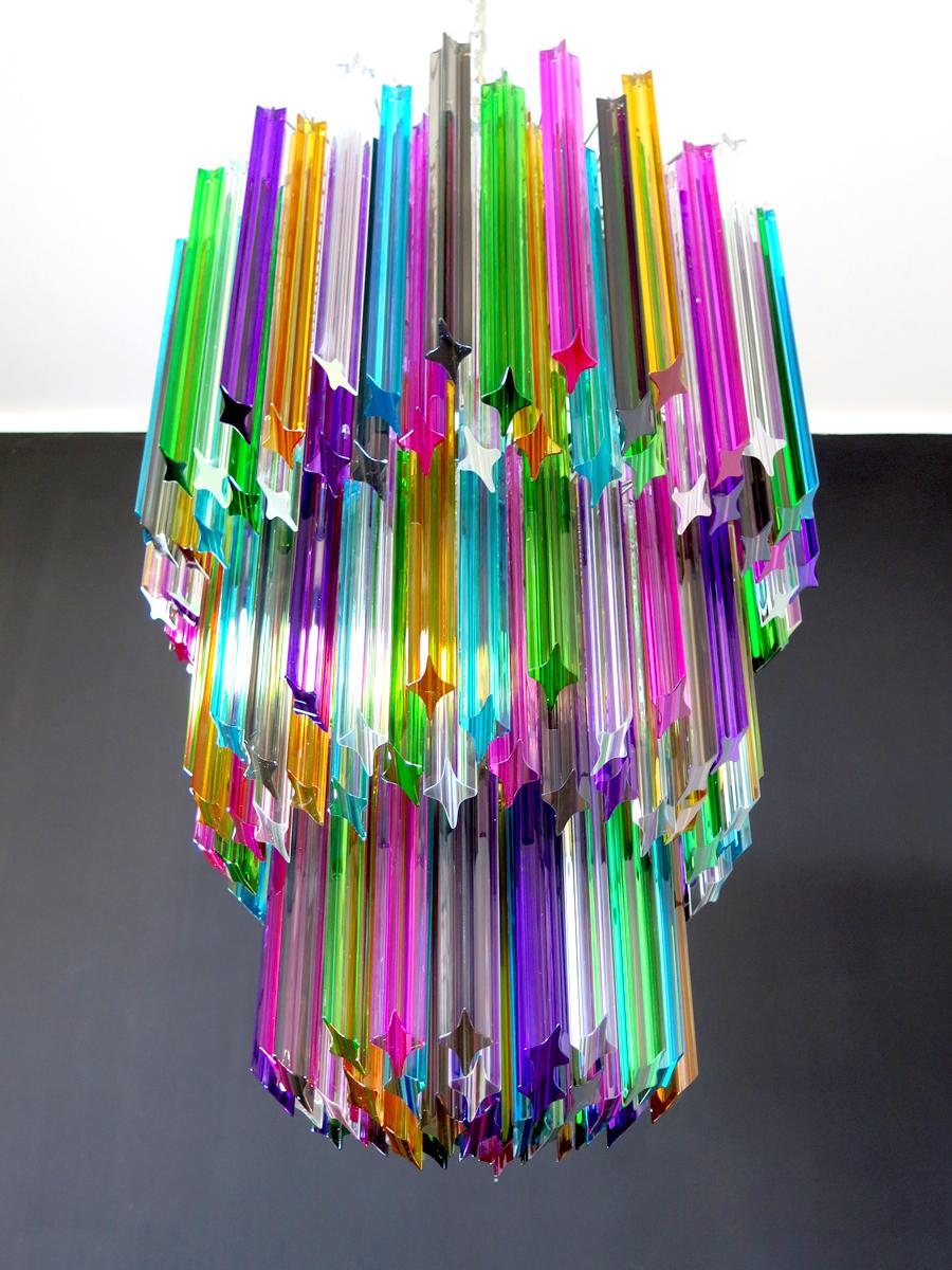 Fantastic vintage Murano chandelier made by 184 Murano crystal multicolored prism (QUADRIEDRI) in a nickel metal frame. The glasses are transparent, blue, smoky, purple, green, yellow and pink. The glasses have two different sizes.
Period: