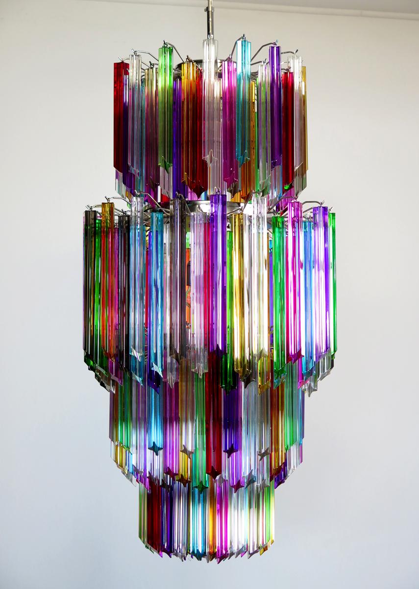 Fantastic vintage Murano chandelier made by 242 Murano crystal multicolored prism (Quadriedri) on four levels in a nickel metal frame. The glasses are transparent, blue, smoky, purple, green, yellow and pink. The glasses have two different