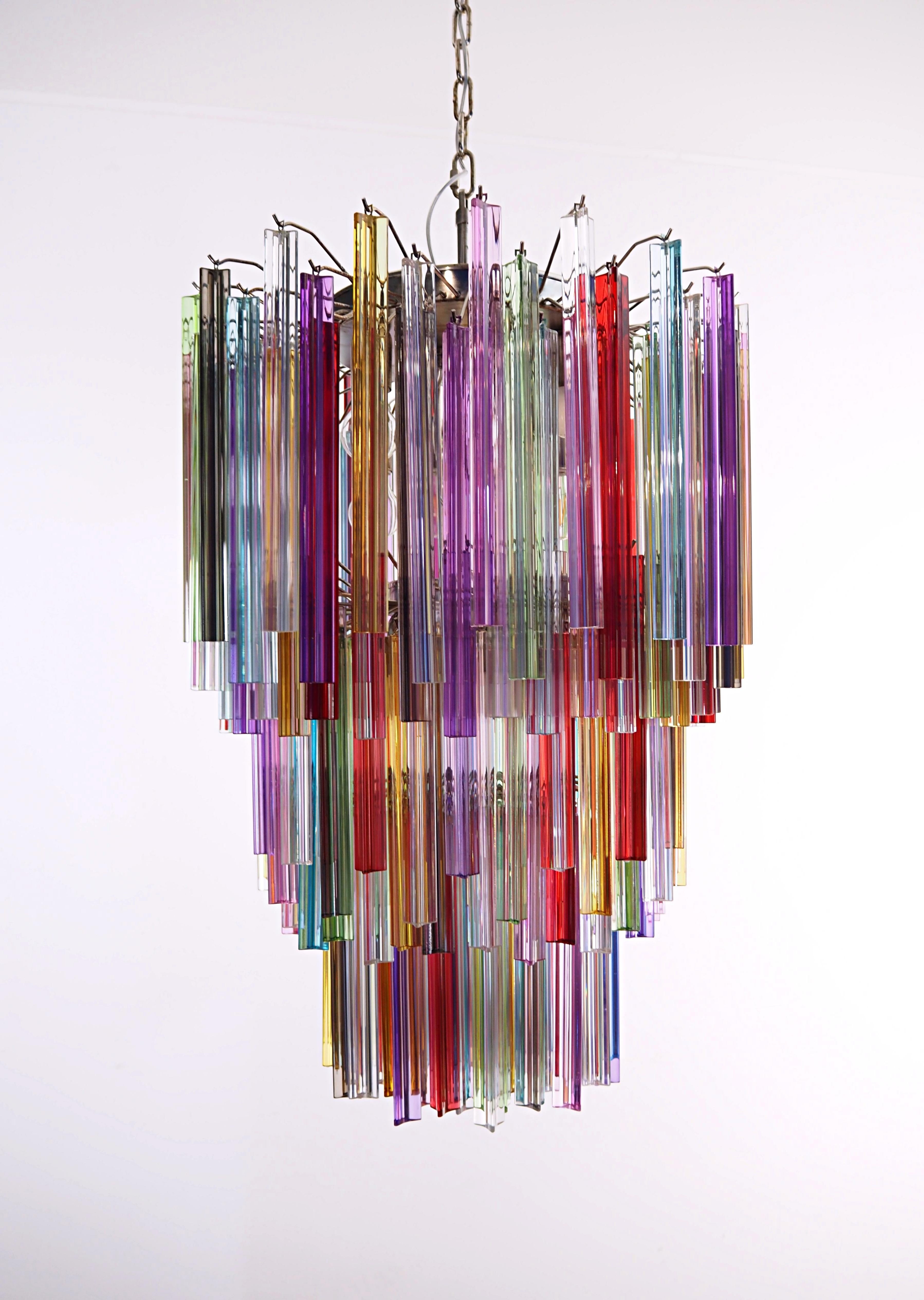 Fantastic vintage Murano chandelier made by 187 Murano crystal multicolored prism in a nickel metal frame. The glasses are transparent, blue, smoky, purple, green, yellow and pink. The glasses have two different sizes.
Period:	late XX