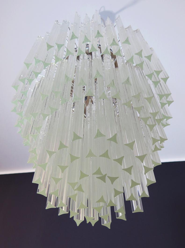 Fantastic vintage Murano chandelier made by 184 Murano trasparent crystal prism in a nickel metal frame. The glasses have two different sizes.
Period: late 20th century
Dimensions: 66.90 inches height (170 cm) with chain; 37.40 inches height (95 cm)