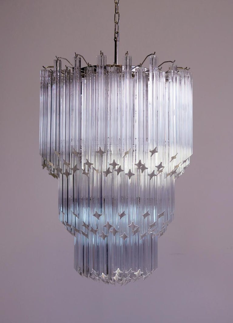 Fantastic vintage Murano chandelier made by 182 Murano transparent crystal prism in a nickel metal frame. The glasses have two different sizes.
Period: late 20th century
Dimensions: 66,90 inches height (170 cm) with chain; 37,40 inches height (95