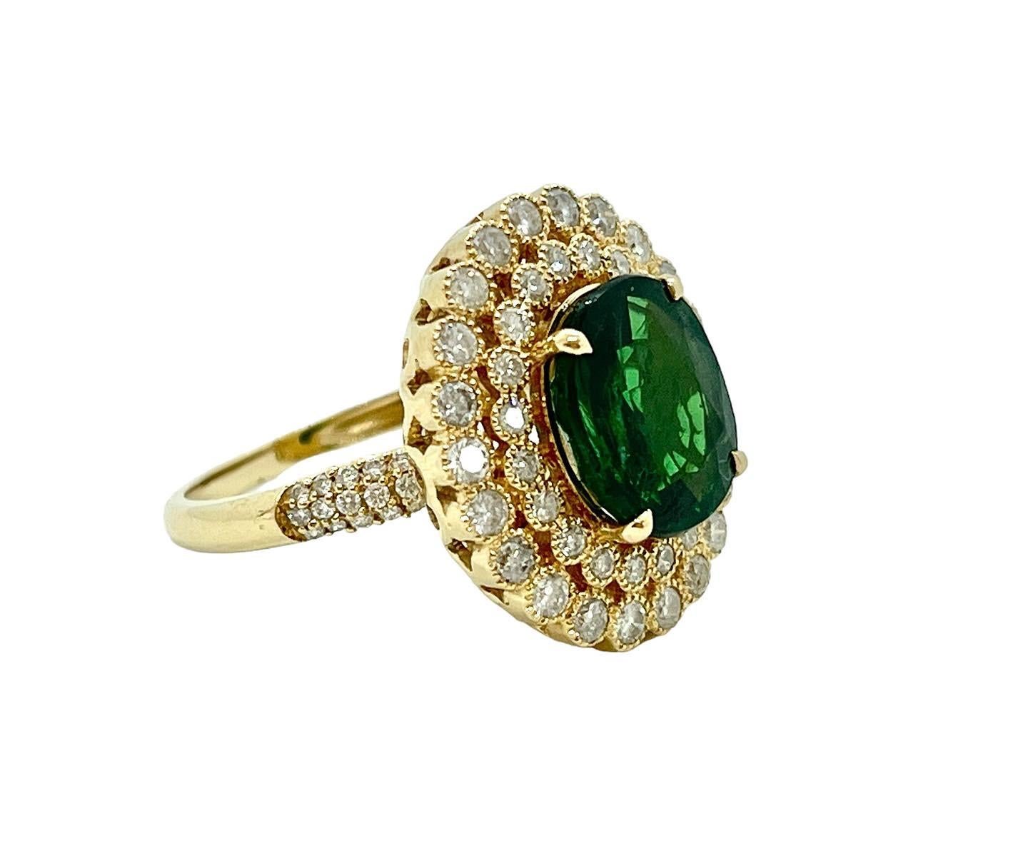 Take a Good Look at this Stunning Gemstone Ring 
You Won’t Find Another Like It!

The star of this piece is the large, 4.52ct Tsavorite Garnet.  Tsavorites of this size, colour and clarity is very rare and we are thrilled to have acquired it into