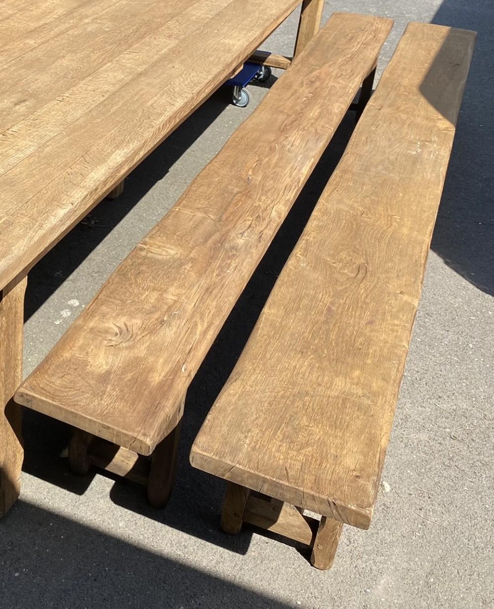 A fabulous Pair of French solid Oak dining benches, Huge at 335 cm long and unlike a lot of benches a good seating depth too. They match the superb table we also have listed. Made of solid oak and very heavy we have bleached them for a lighter look