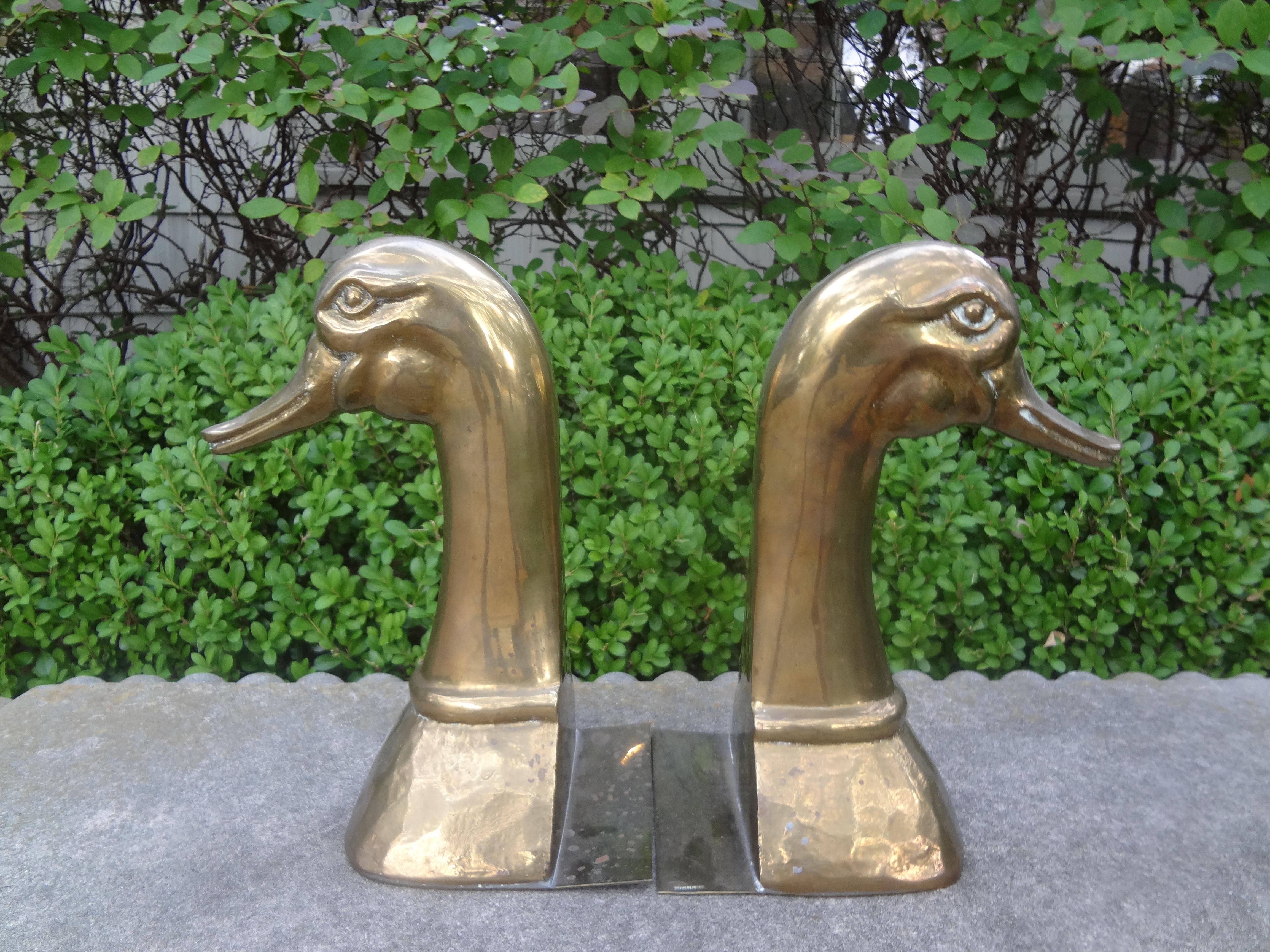 Large pair of Hollywood Regency polished brass bookends by Sarreid Ltd. This handsome pair of brass bookends is the largest size we have seen. Dimensions: 10