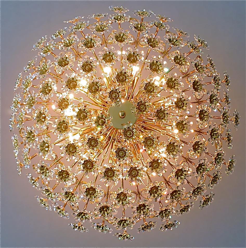 Huge round gilt brass metal crystal glass flush mount chandelier made by Palwa, Germany, circa 1960-1970, documented in the Palwa sales catalog and signed with Palwa company label with model number. The gorgeous ceiling light has lots of beautiful