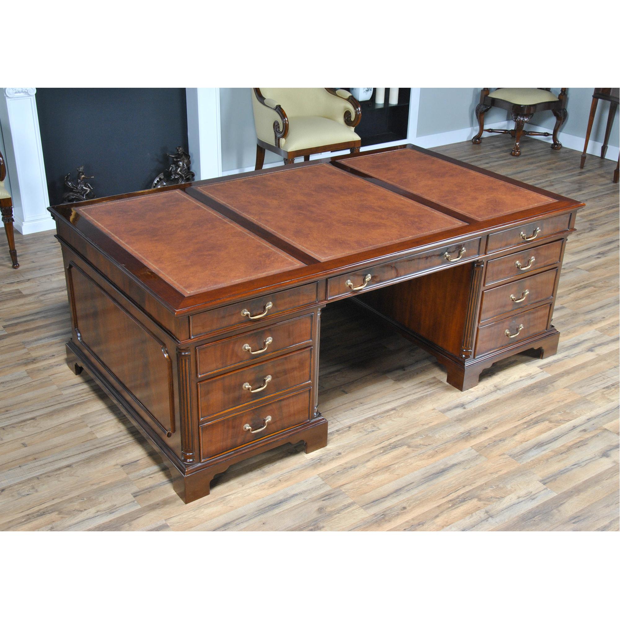 This is the Huge Partners Desk in the Niagara Furniture collection. This desk behemoth matches a number of other pieces which we produce. The fantastic solid mahogany top frame is inset with three genuine, full grain leather panels, each tooled with