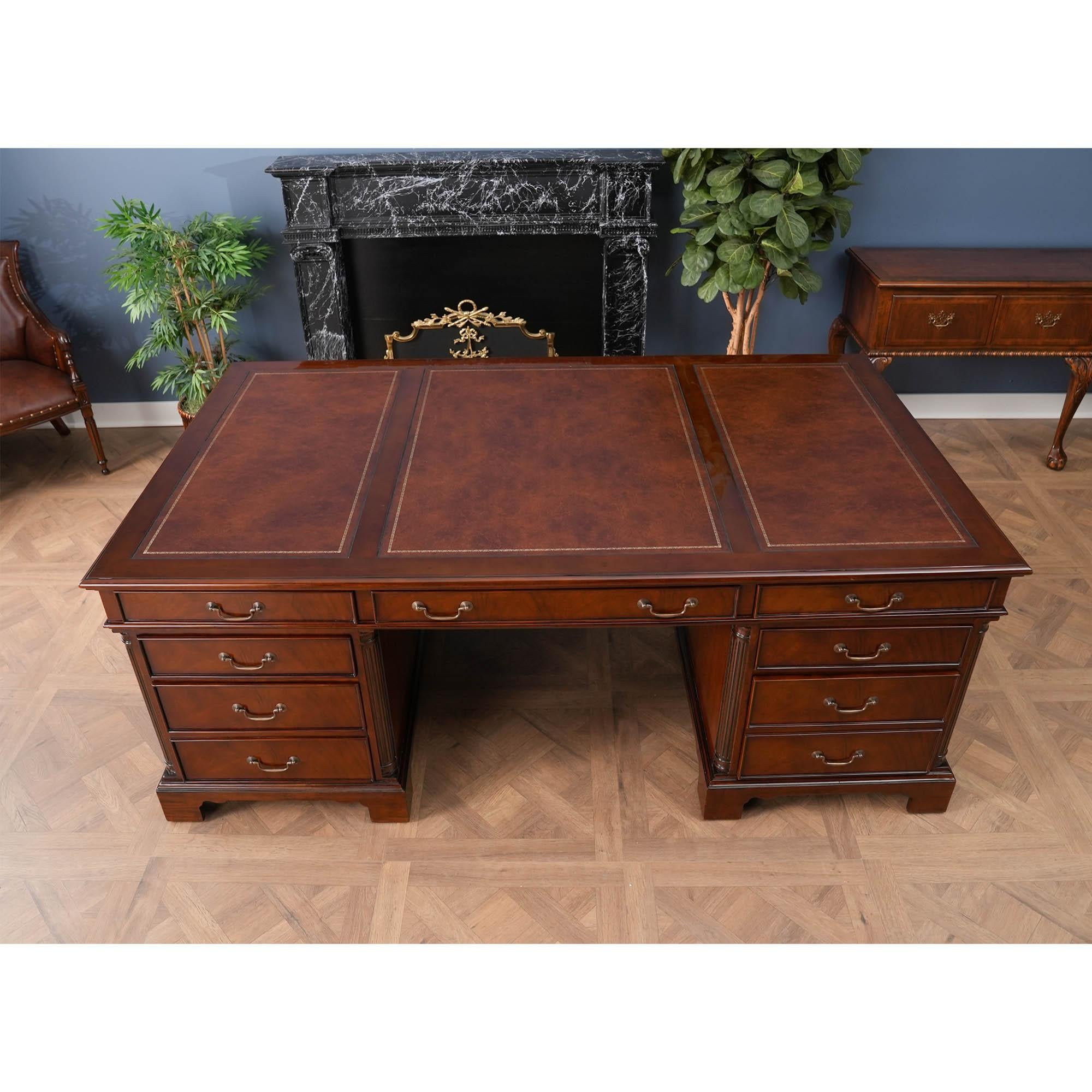 This is the Huge Partners Desk in the Niagara Furniture collection. This desk behemoth matches a number of other pieces which we produce. The fantastic solid mahogany top frame is inset with three genuine, full grain leather panels, each tooled with