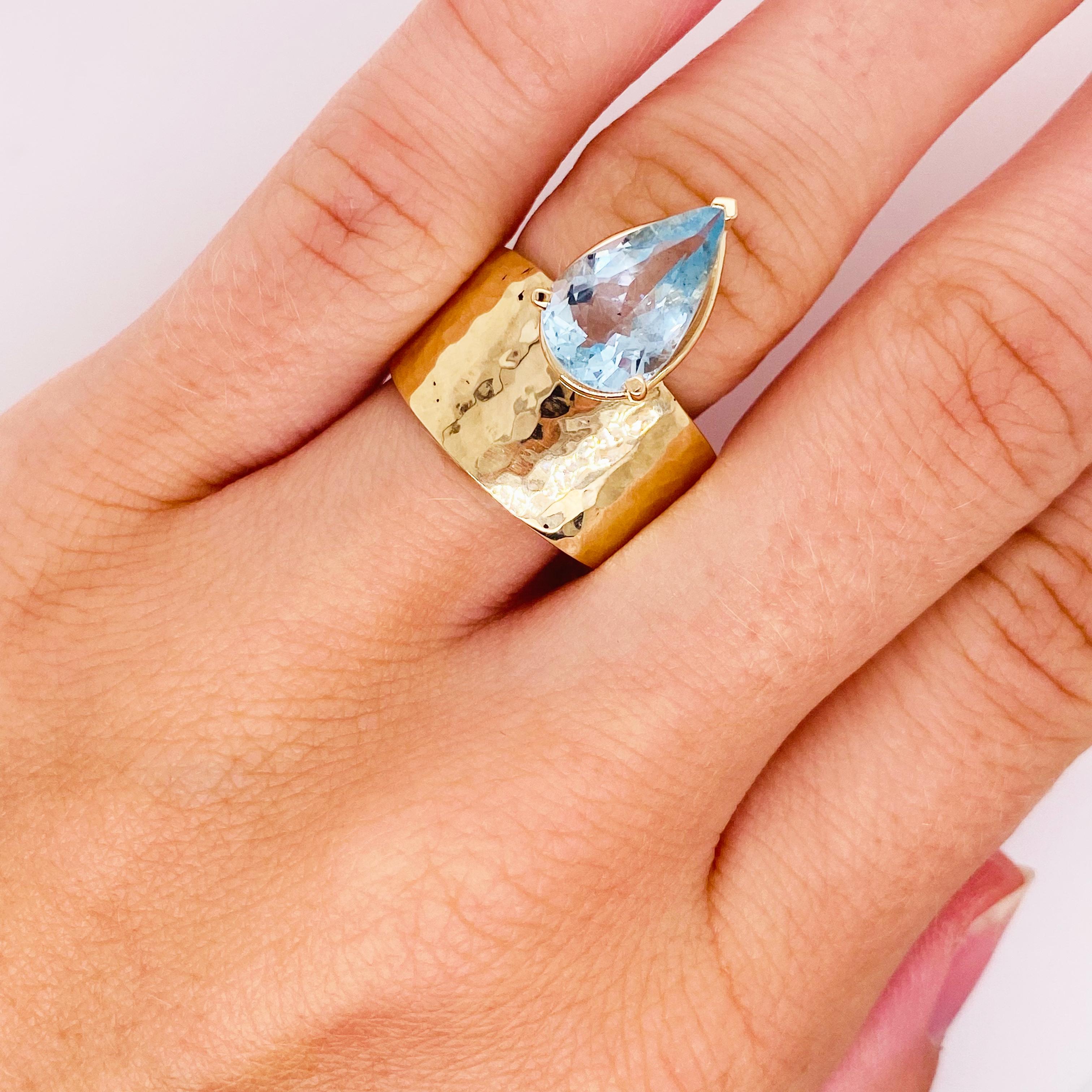 Unique, asymmetrical, custom made ring! Fantastic on larger fingers! Feel like royalty while wearing this ring!
Gemstone: Aquamarine (natural and genuine mined from Brazil)
Carats Weight: 2.69 Carats 
Gemstone Shape: Pear
Ring Size: 8.5 (can be