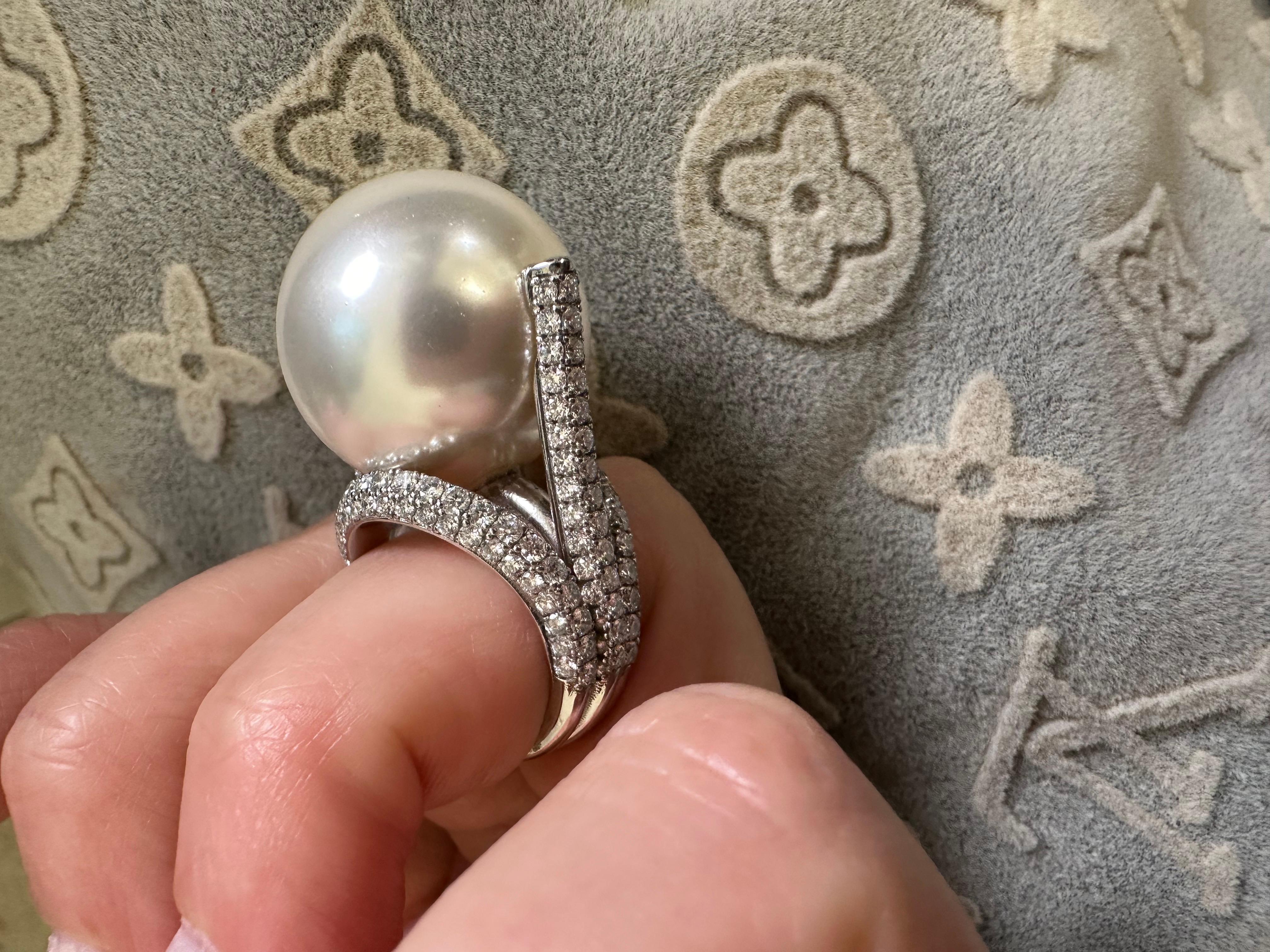 Extraordinary diamond ring with a shell pearl . Over 2 carats of diamonds pave set to perfection in 18KT white gold, stunning luxurios cocktail ring for that perfect black dress!

Shell pearl 20mm:
Color: White
Cut: Round

Natural Diamond(s):