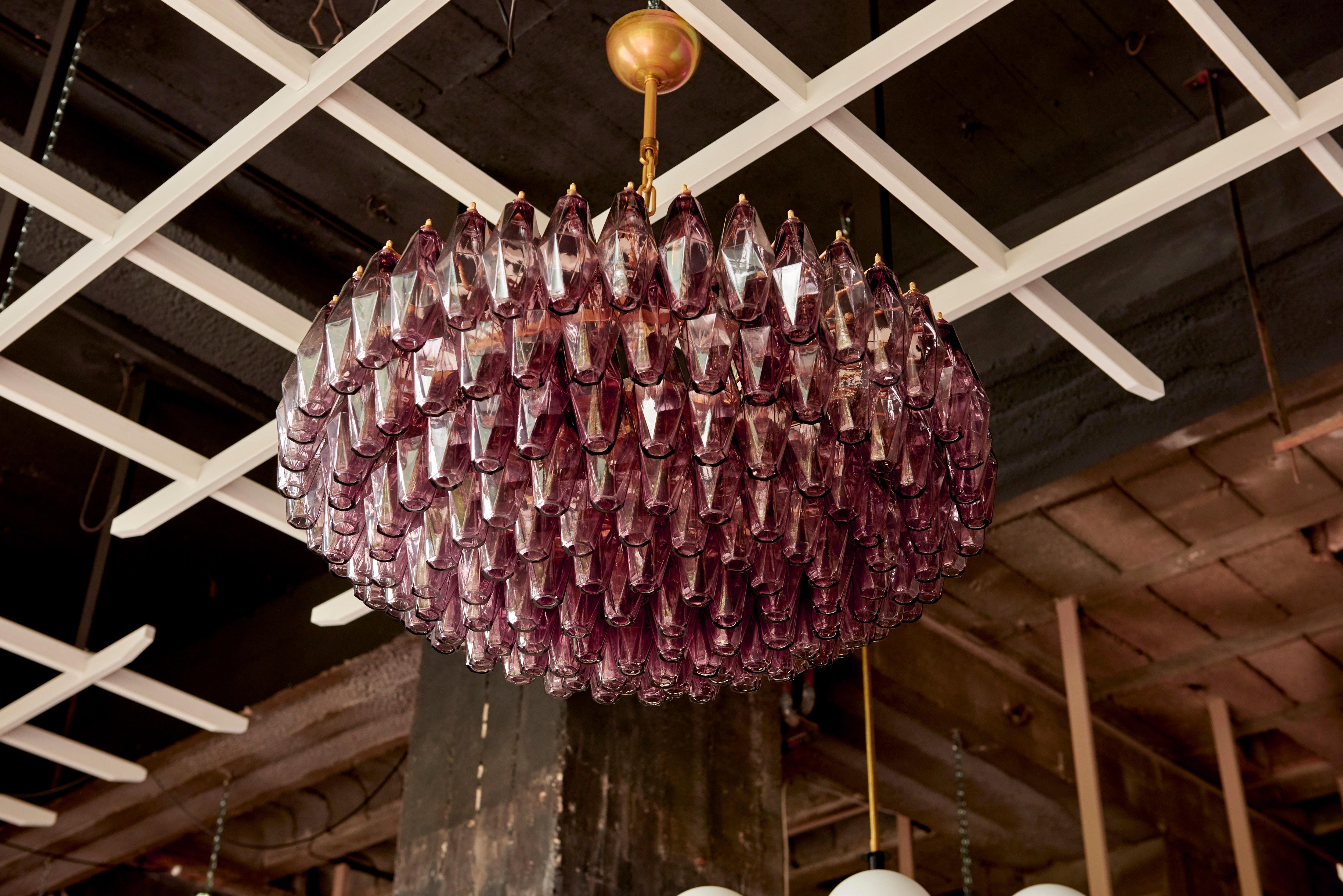 Very huge handblown amethyst Murano glass poliedri or polyhedral chandelier in the manner of Carlo Scarpa for Venini. The chandelier has a impressive size and is in very good condition. 

To be on the safe side, the lamp should be checked locally by