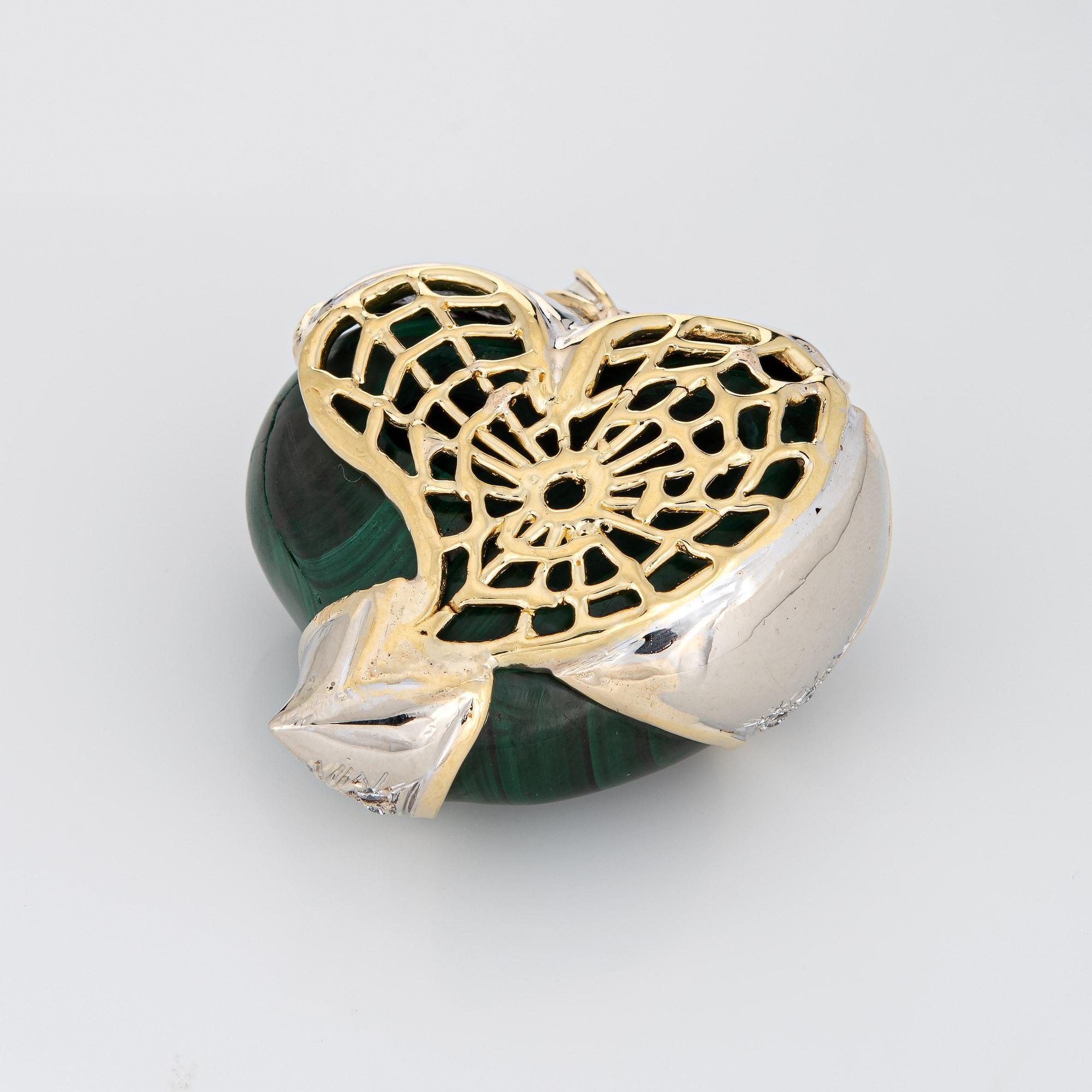 Finely detailed vintage puffed heart pendant crafted in 14k yellow gold (circa 1980s to 1990s).  

Malachite measures 40mm x 35mm, accented with an estimated 0.50 carats of diamonds (estimated at H-I color and VS2-SI2 clarity). The malachite is in