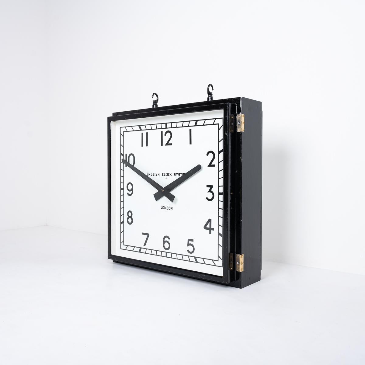 Huge Reclaimed Industrial Double Sided Factory Clock
An original vintage double-sided factory clock hanging clock.

Crafted by English Clock System, London, England, circa 1950.

The clock has been professionally restored.

Everything remains