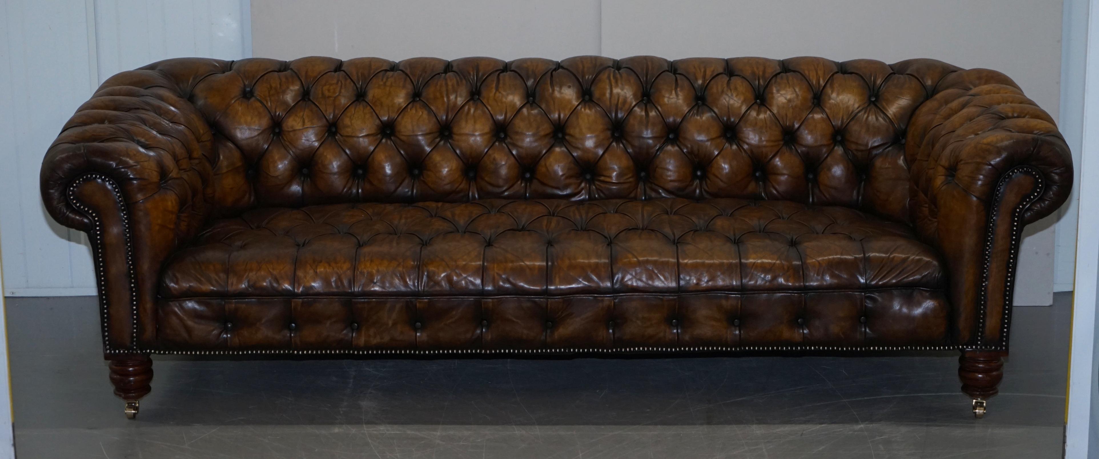 We are delighted to offer for sale this very rare fully restored circa 1860 hand dyed cigar brown leather Chesterfield sofa with original horse hair padding, coil sprung all over and mahogany turned legs with brass castors 

This sofa is a very