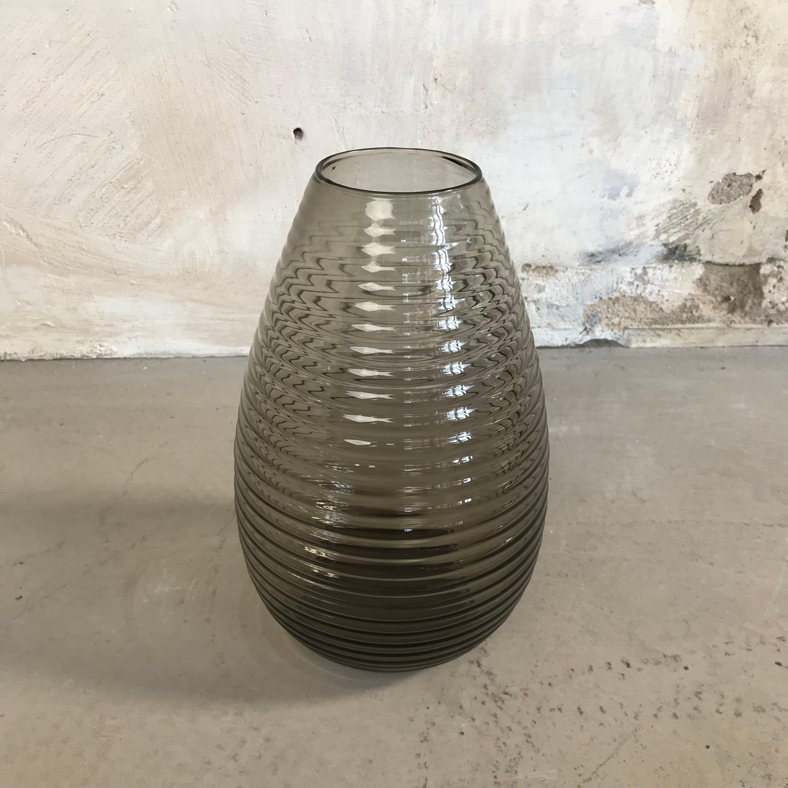 Beautiful fumi colored large vase design A.D. Copier made by Leerdam Glassworks, the Netherlands, 1956- 1960.
Very rare in this large size!
A stylish teardrop shape with horizontal ribbs. The vase was a great success after the war, nowadays it is