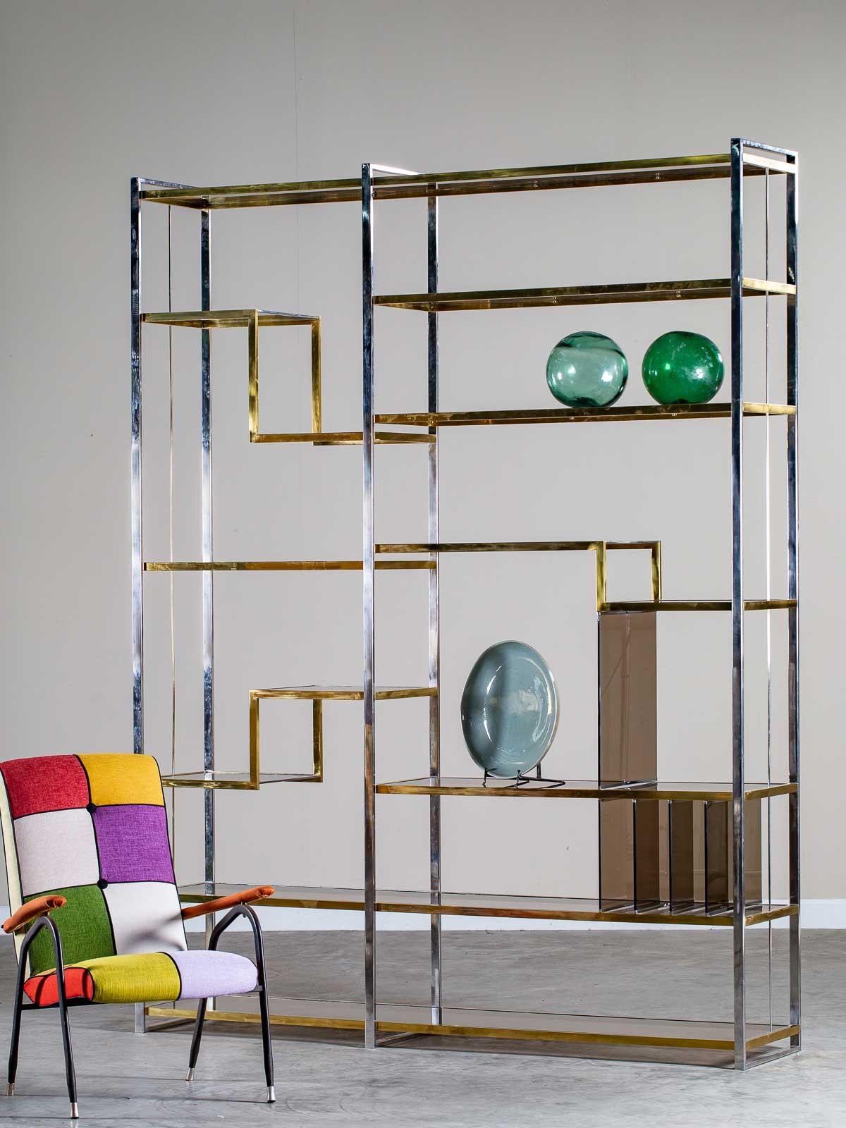 A stunning large scale Romeo Rega vintage Italian chrome and brass étagère shelving unit from Italy circa 1975. Rega's use of brilliant chrome and brass was a signature hallmark as he joined in with the designers Willy Rizzo and Gabriella Crespi to