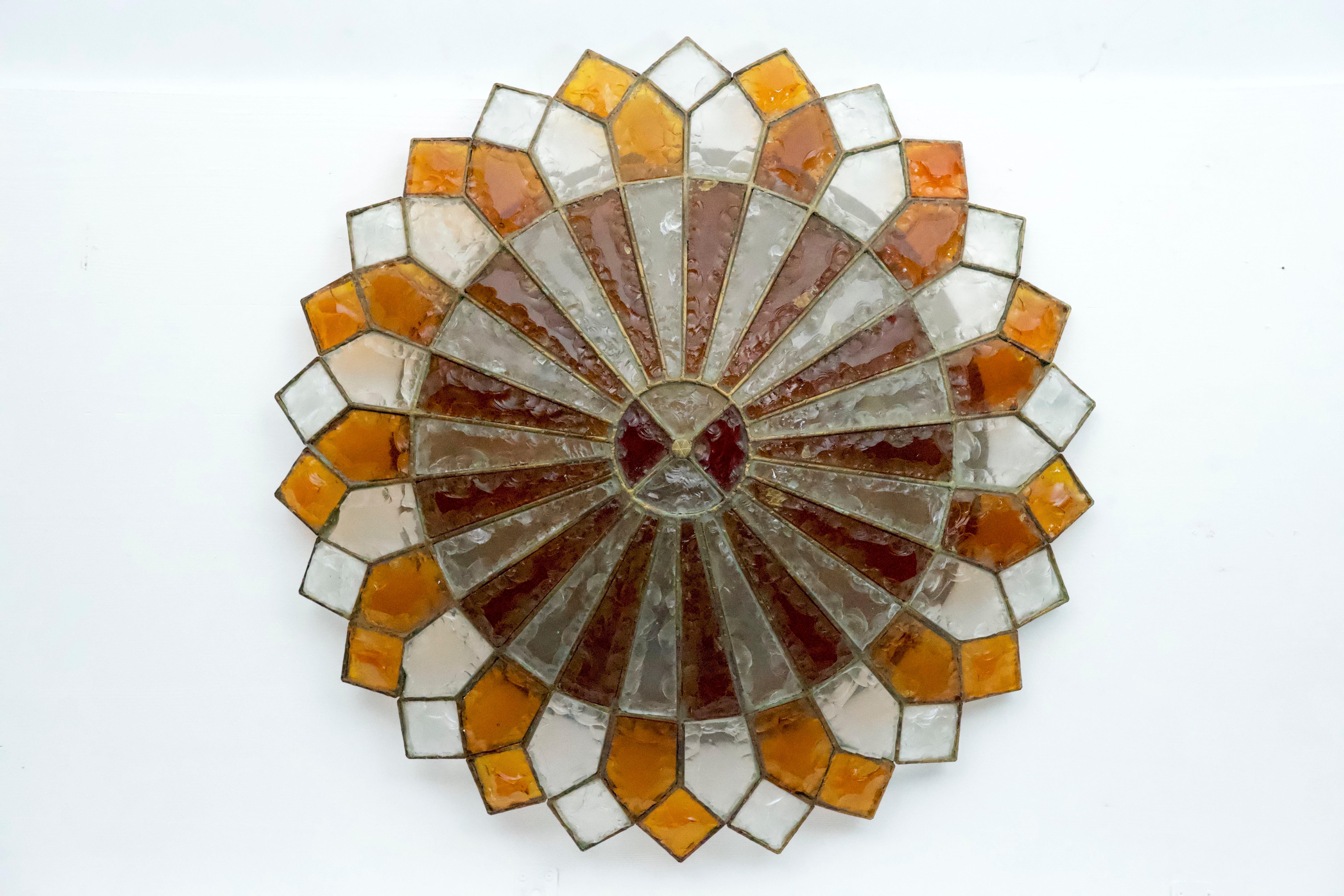 This large, round flush mount can function as either a ceiling or wall lamp. Crafted from thick Murano glass and produced by Poliarte in Verona, Italy, circa 1970, it remains in very good vintage condition with light signs of age and use. The lamp