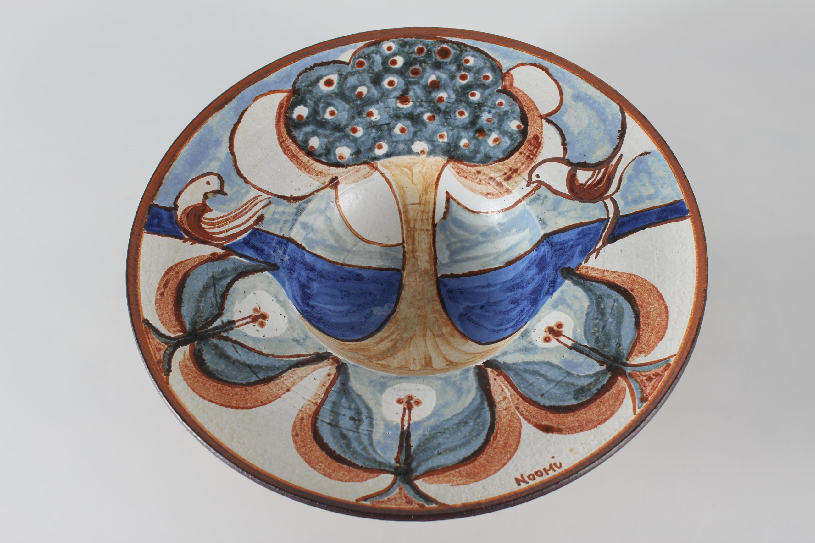 Huge ceramic bowl by Noomi Backhausen for Søholm Denmark.
This bowl with the tree of life motif is made of chamotte clay which gives it a vivid surface. 
It's decorated with off-white, brown, dark blue, light blue, and green colors and the glaze