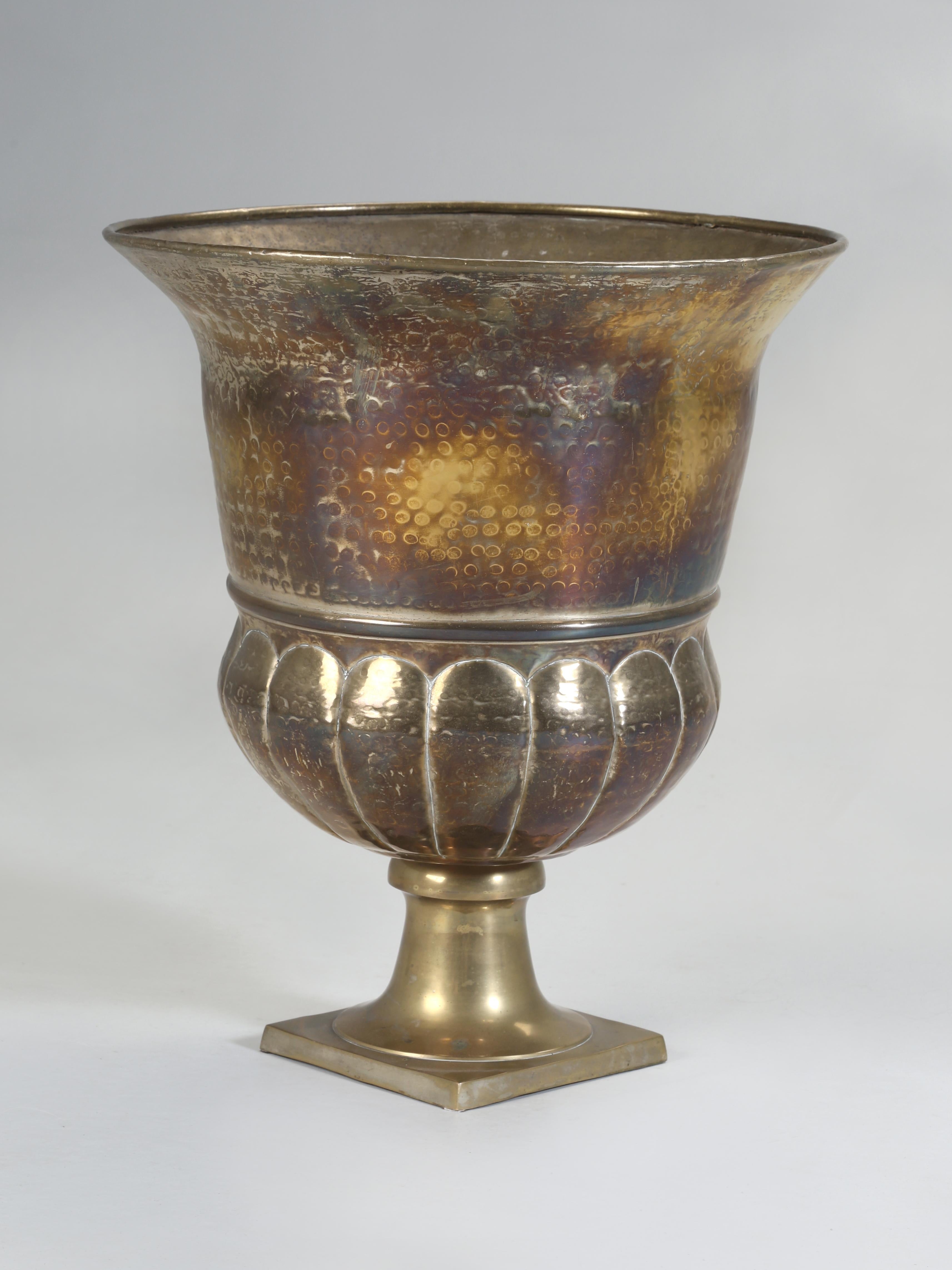Beautiful huge solid Brass Vase or Solid Brass Urn. The brass was hand-hammered and give the vase a great texture. Since the vase or urn is made from brass, it is quite easy to polish, but as soon as we do, I am sure someone is going to walk into