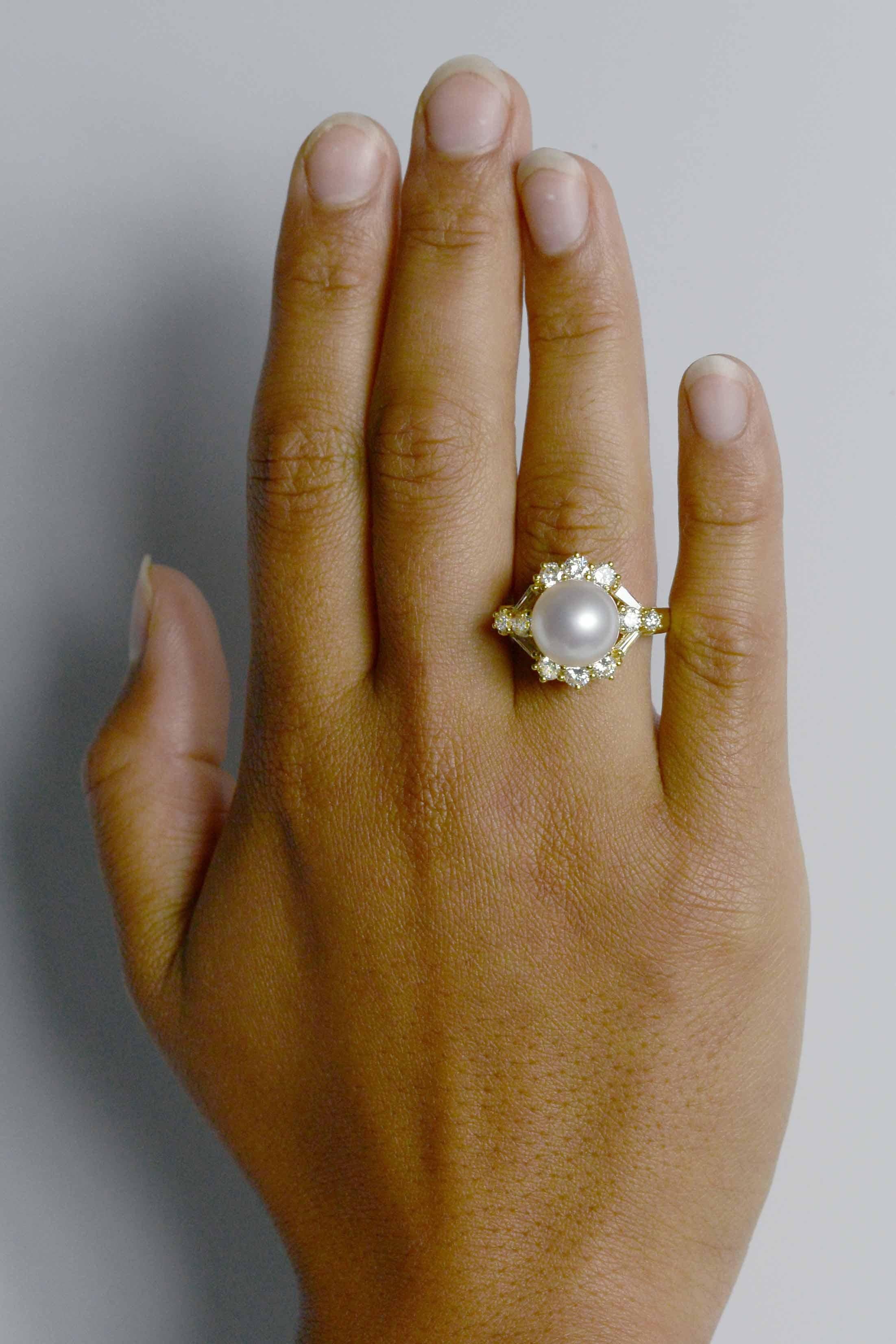 This amazing white South Sea pearl and diamond cocktail ring is centered by a rare, 11.4 mm perfectly round glowing dome of high luster with a mesmerizing rose overtone. The flawless complexion mirrors the fire of the 14 diamonds arranged in a
