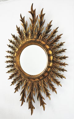Mid-Century Spanish Oval Sunburst Mirror in Carved Giltwood