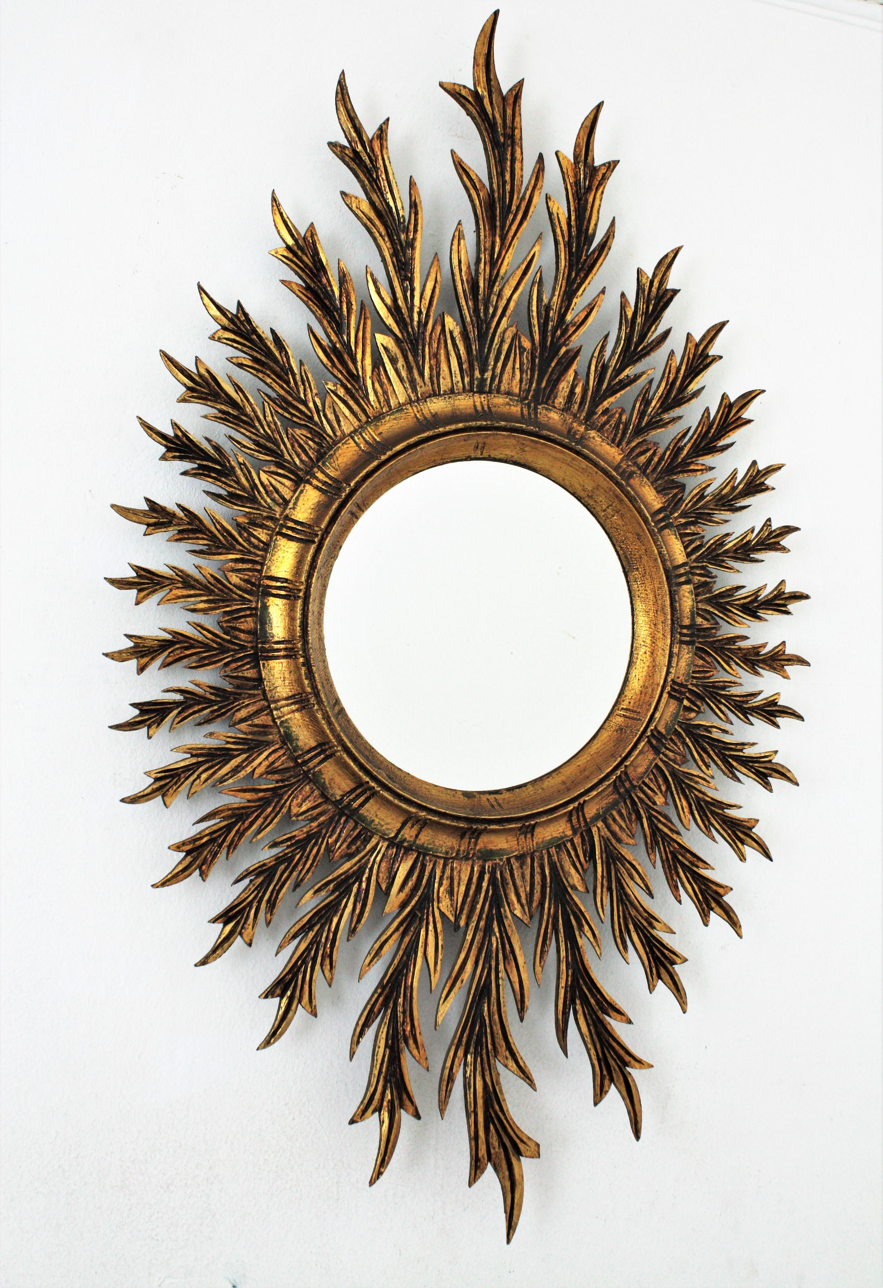 Mid-Century Modern Mid-Century Spanish Oval Sunburst Mirror in Carved Giltwood