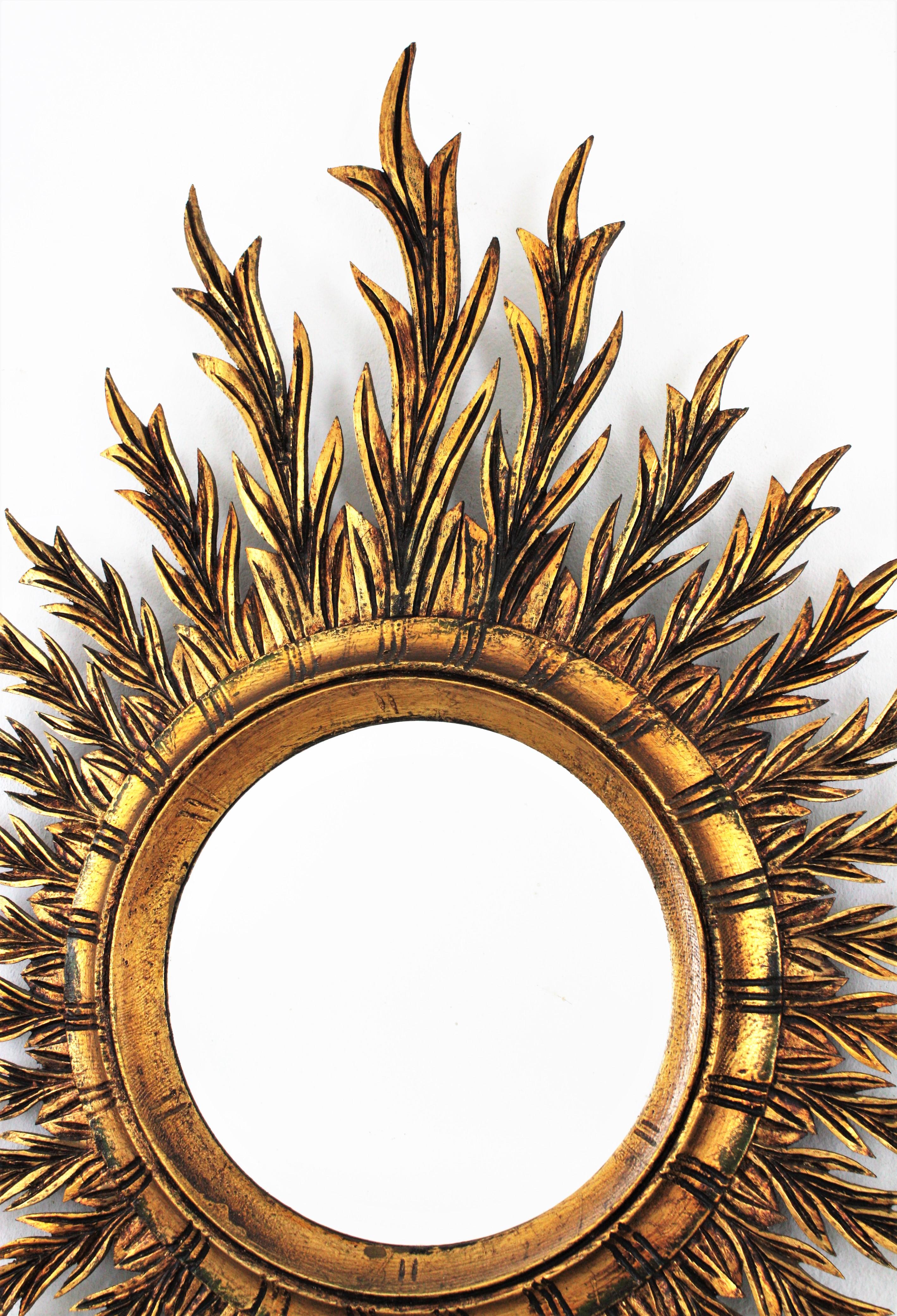 20th Century Mid-Century Spanish Oval Sunburst Mirror in Carved Giltwood