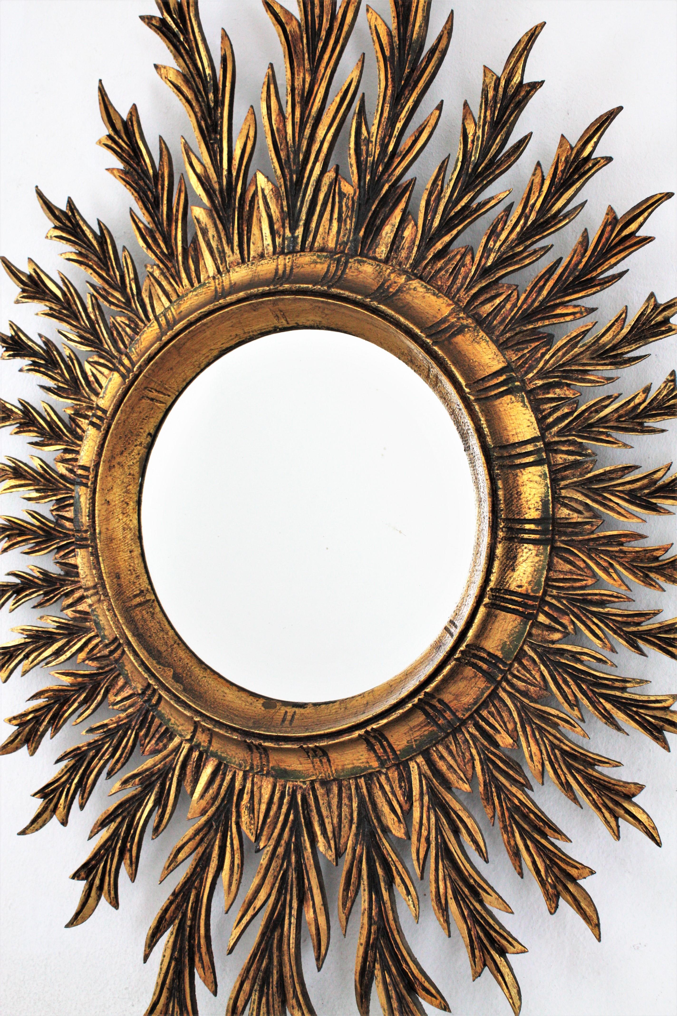 20th Century Mid-Century Spanish Oval Sunburst Mirror in Carved Giltwood
