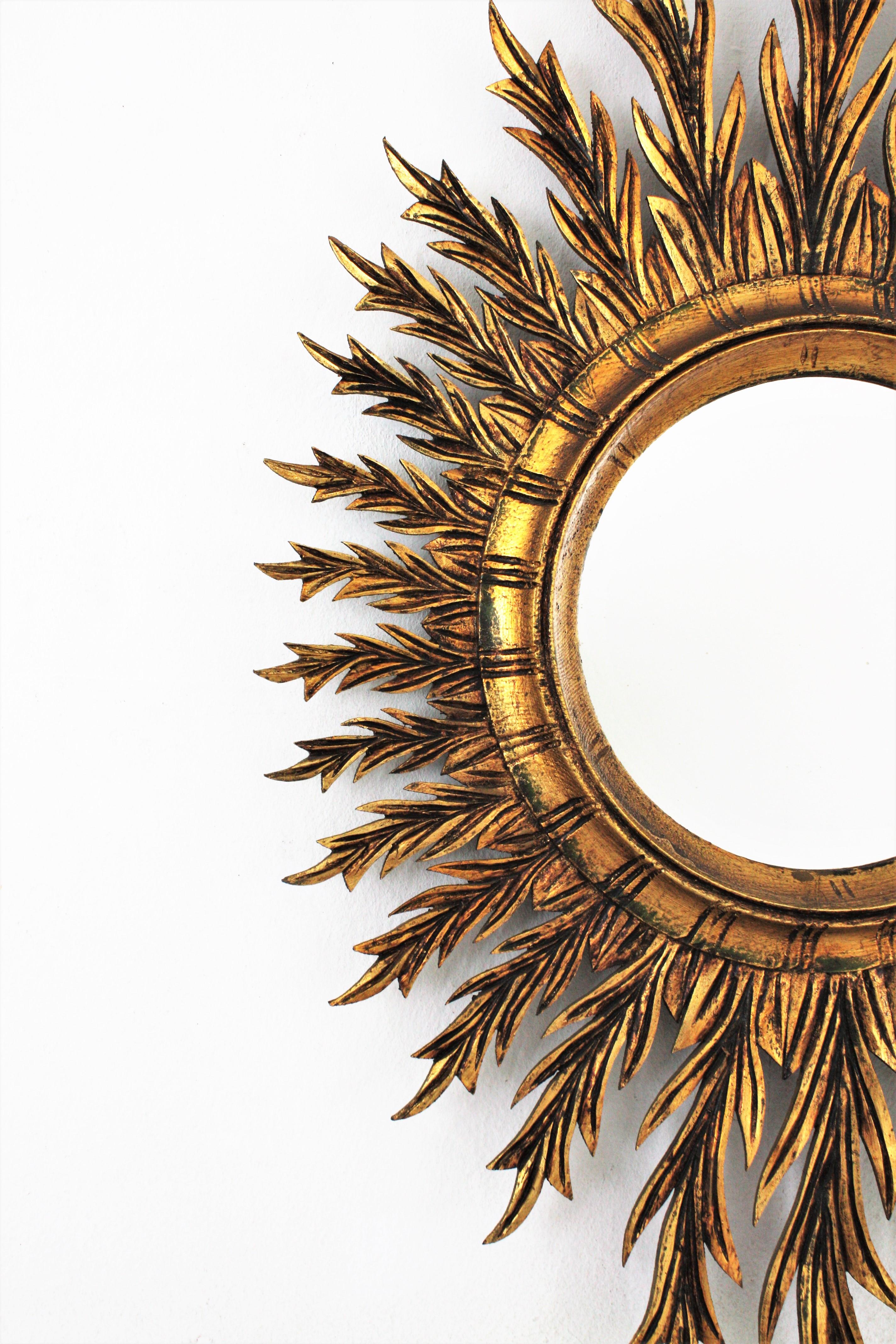 Mid-Century Spanish Oval Sunburst Mirror in Carved Giltwood 1