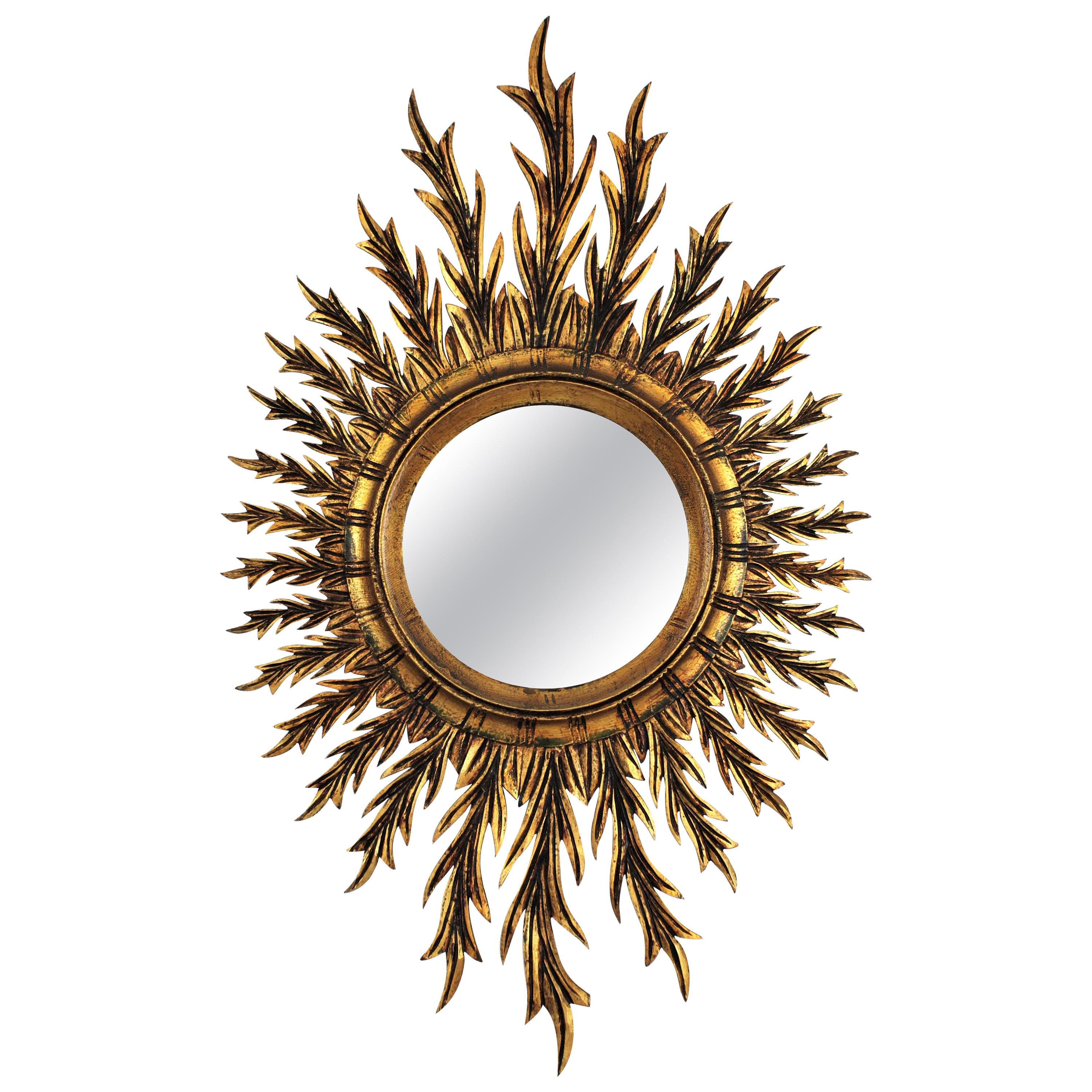 Mid-Century Spanish Oval Sunburst Mirror in Carved Giltwood