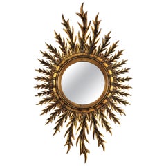 Vintage Mid-Century Spanish Oval Sunburst Mirror in Carved Giltwood