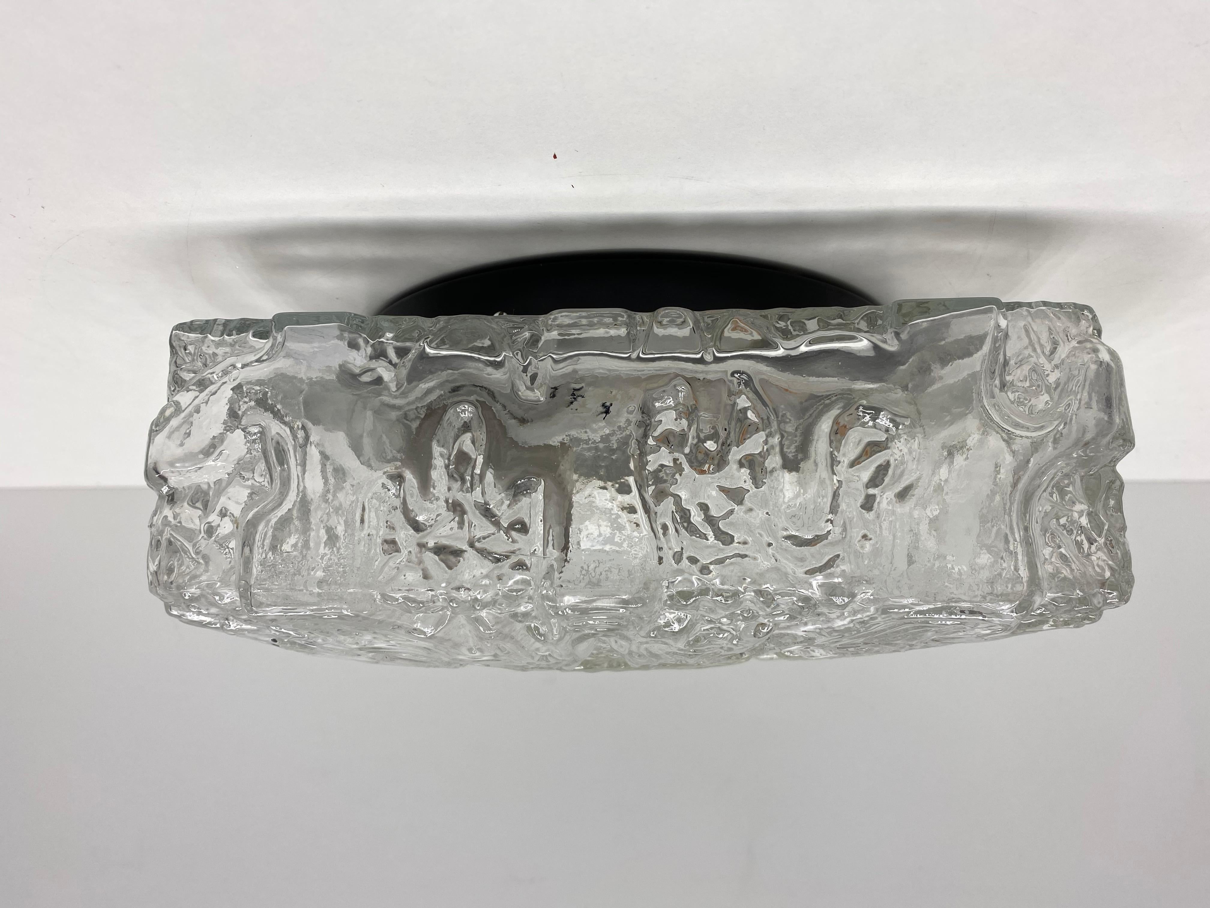 A gorgeous flush mount by German Manufacturer. Heavy ice glass on a metal fixture. The flush mount requires one European E27 Edison bulb, up to 60 watts.