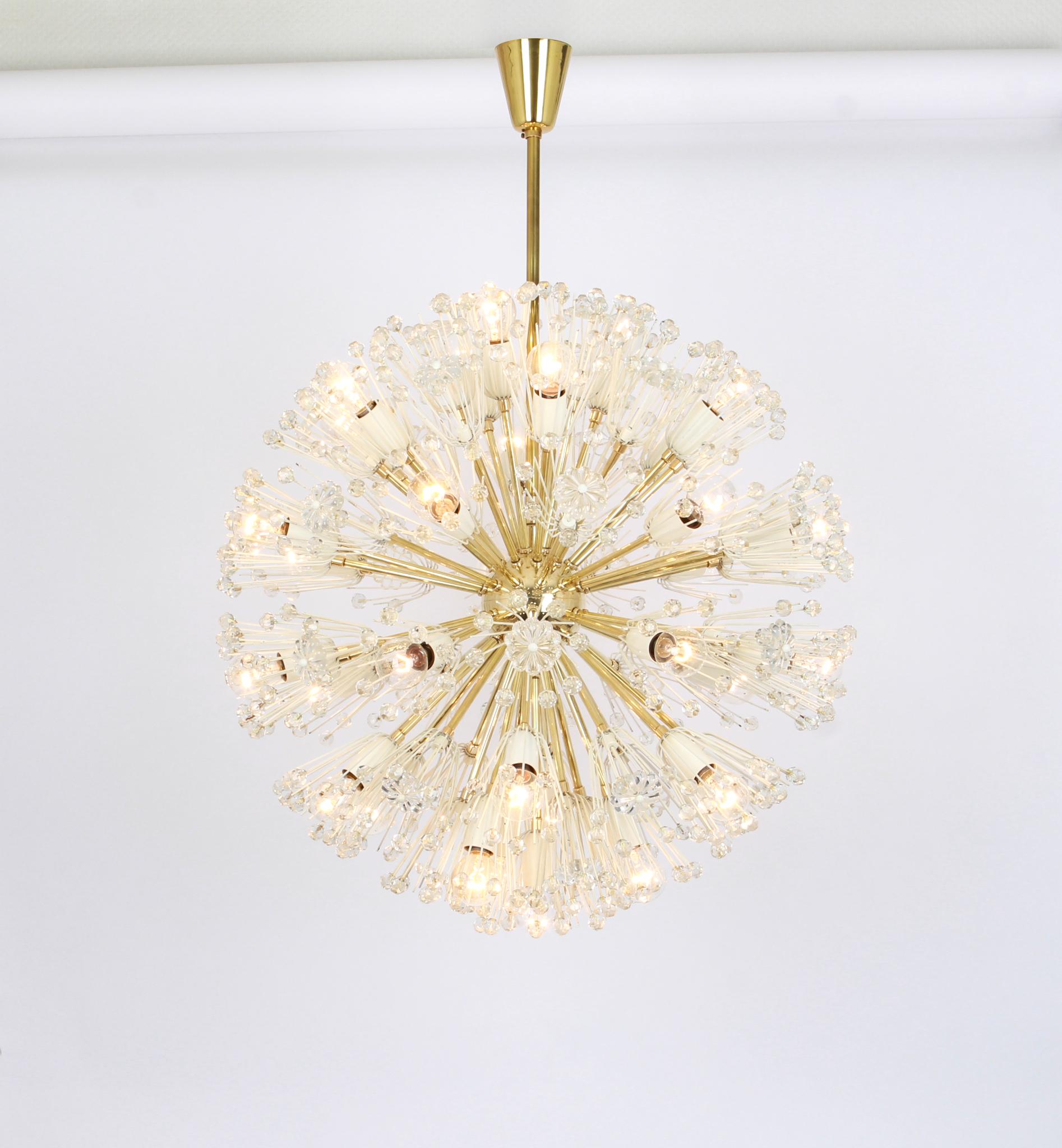 Beautiful large starburst brass chandelier with hundreds of crystals designed by Emil Stejnar for Nikoll, manufactured in Austria, circa 1960s.

Sockets: 32 x E14 bulbs.
Very good condition.

Drop rod can be adjusted as required, free of