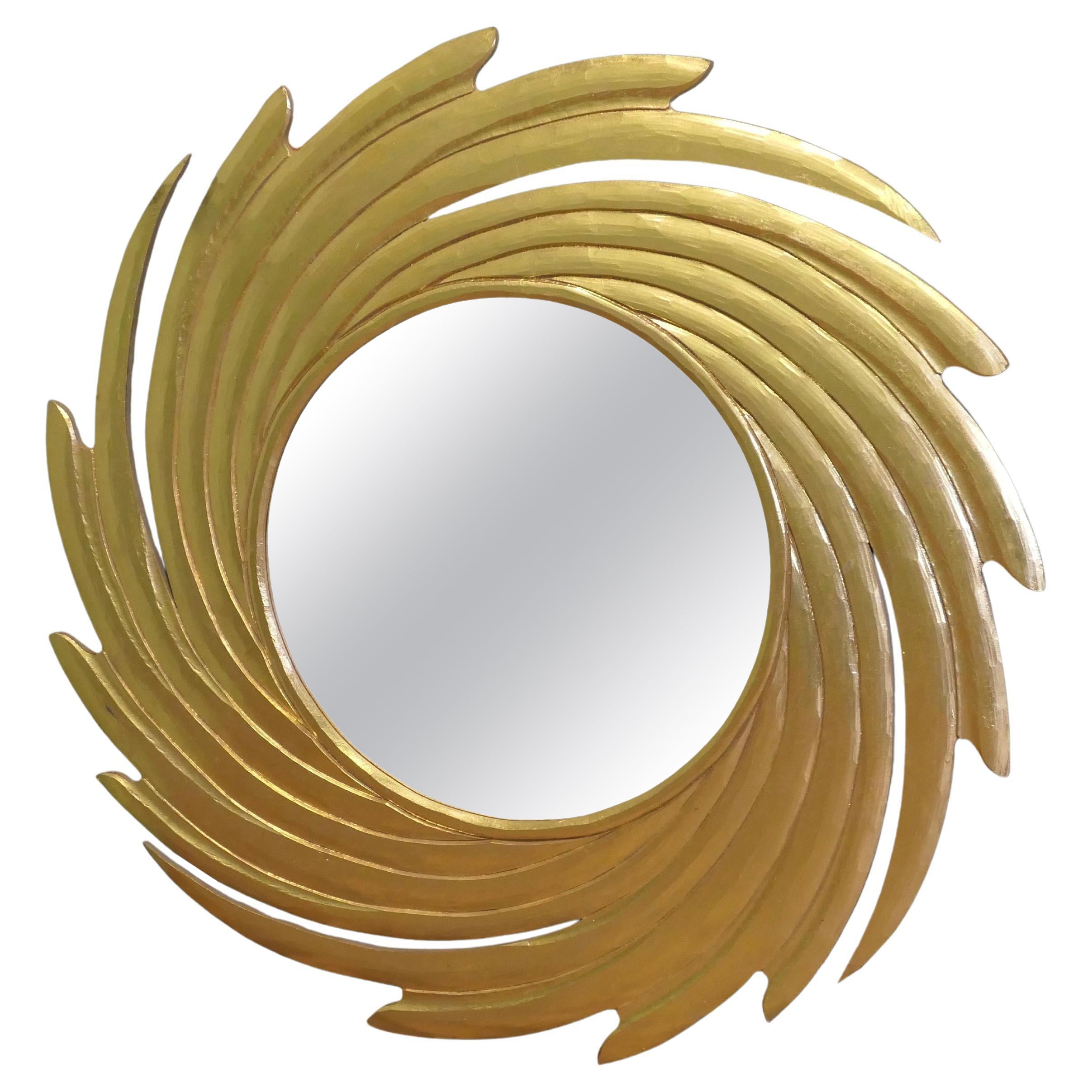 Grand miroir doré en forme de tourbillon en forme de soleil  Une superbe pièce