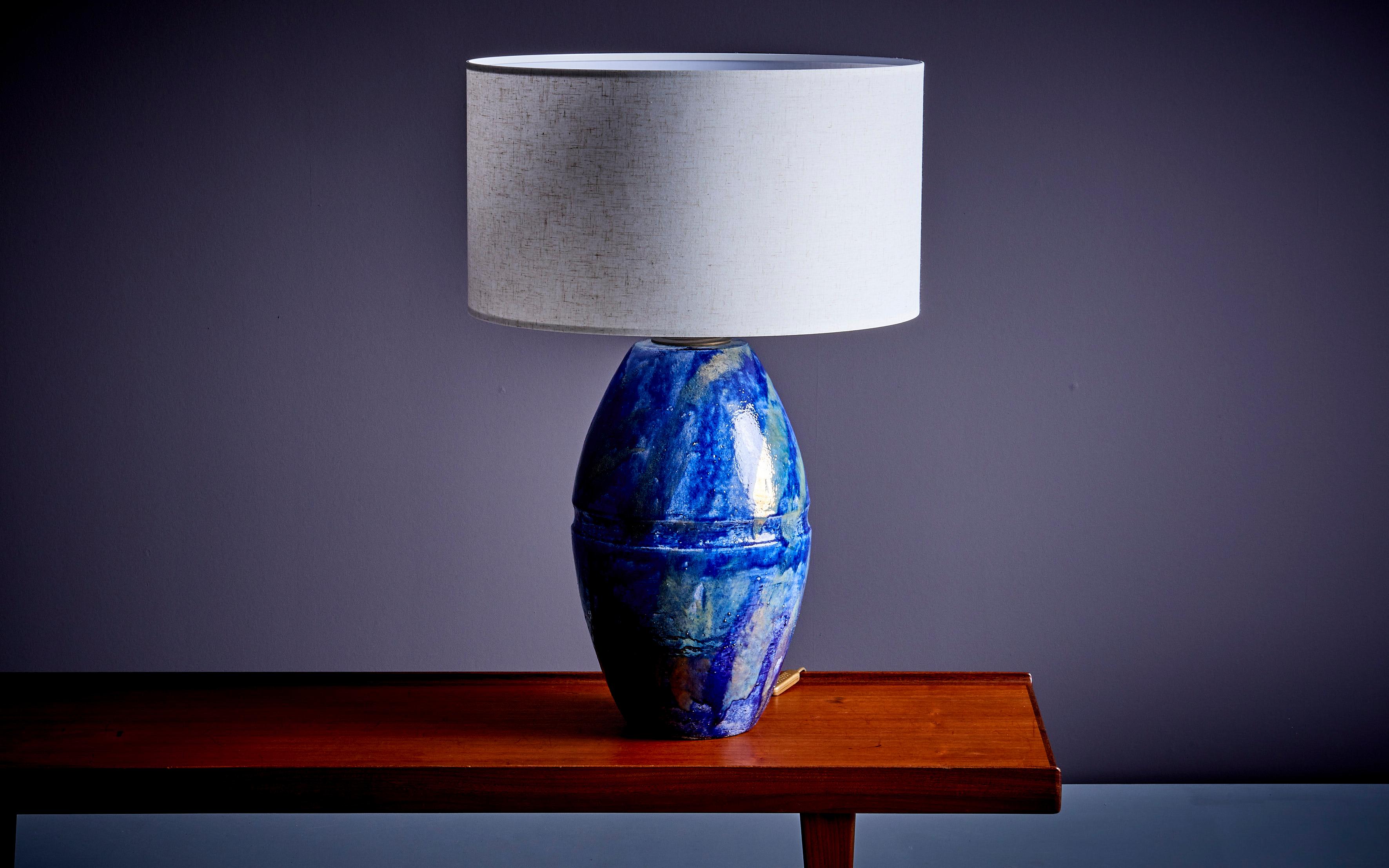 Huge Table Lamp in Blue Ceramic, France - 1960s. The measurements given apply to the lamp without the shade. The lamp incl. the shade measures 75cm in height, 50cm in diameter. Socket: 1x E27. Please note: Lamp should be fitted professionally in