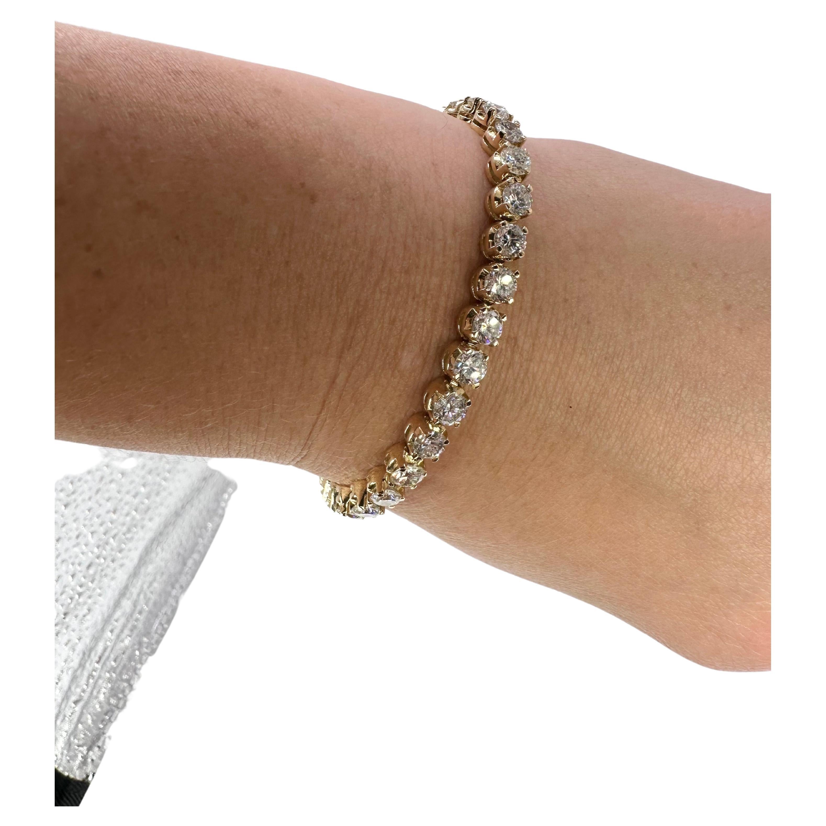 Stunning luxurious tennis bracelet in 18KT yellow gold with 9.90 carats of diamonds and astonishing sparkle!!!!!!!This bracelet will be noticed,It has this wow effect! Made in 4 prong setting with 33 diamonds.

GOLD: 18KT gold
NATURAL