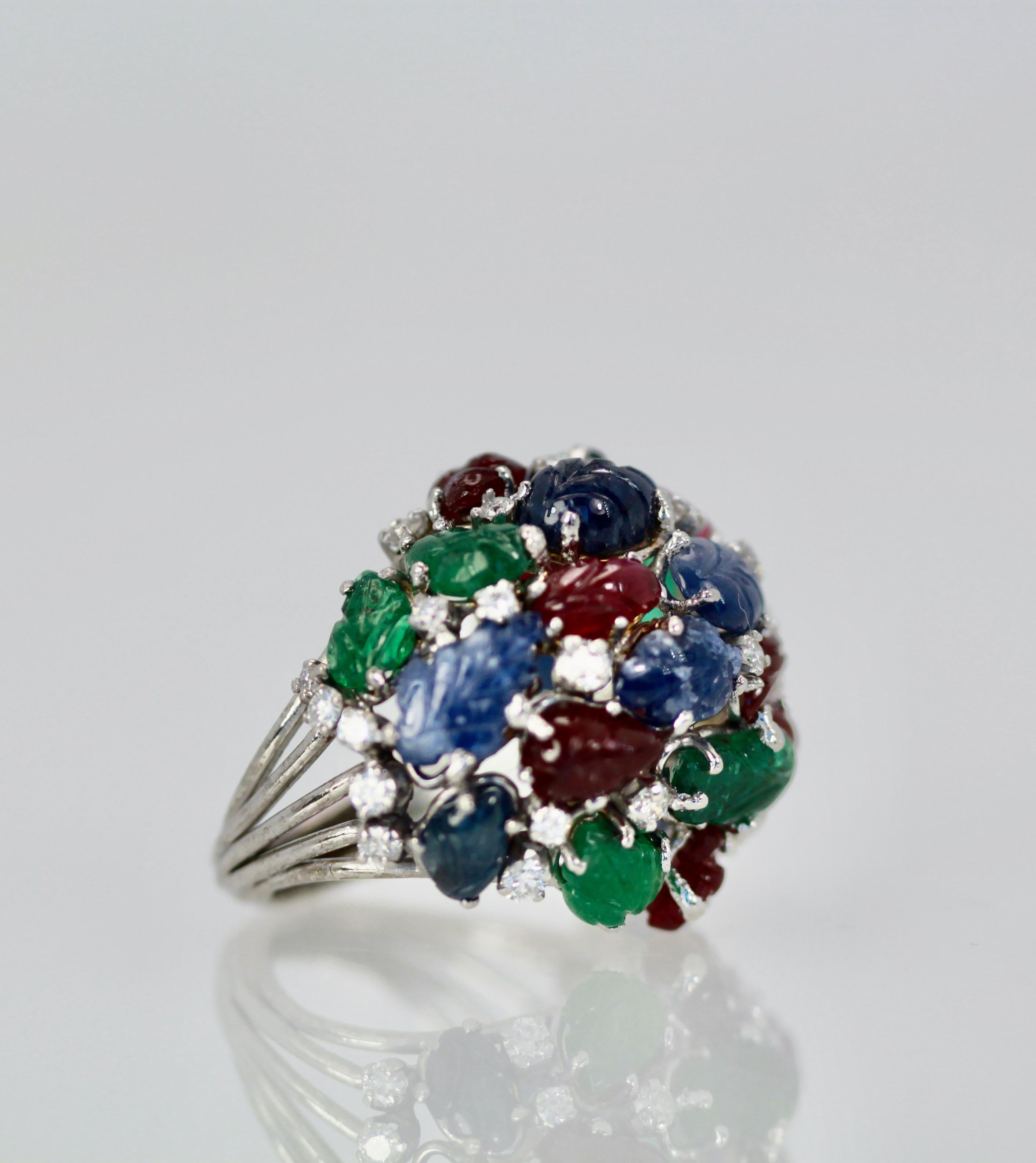 This huge Tutti Frutti Ring is special due to its size and the gorgeous carved gemstone leaves.  There are Rubies, Emeralds, Sapphires with Diamonds interspersed throughout.  Tutti frutti jewelry is rare and special as most of it was made in the