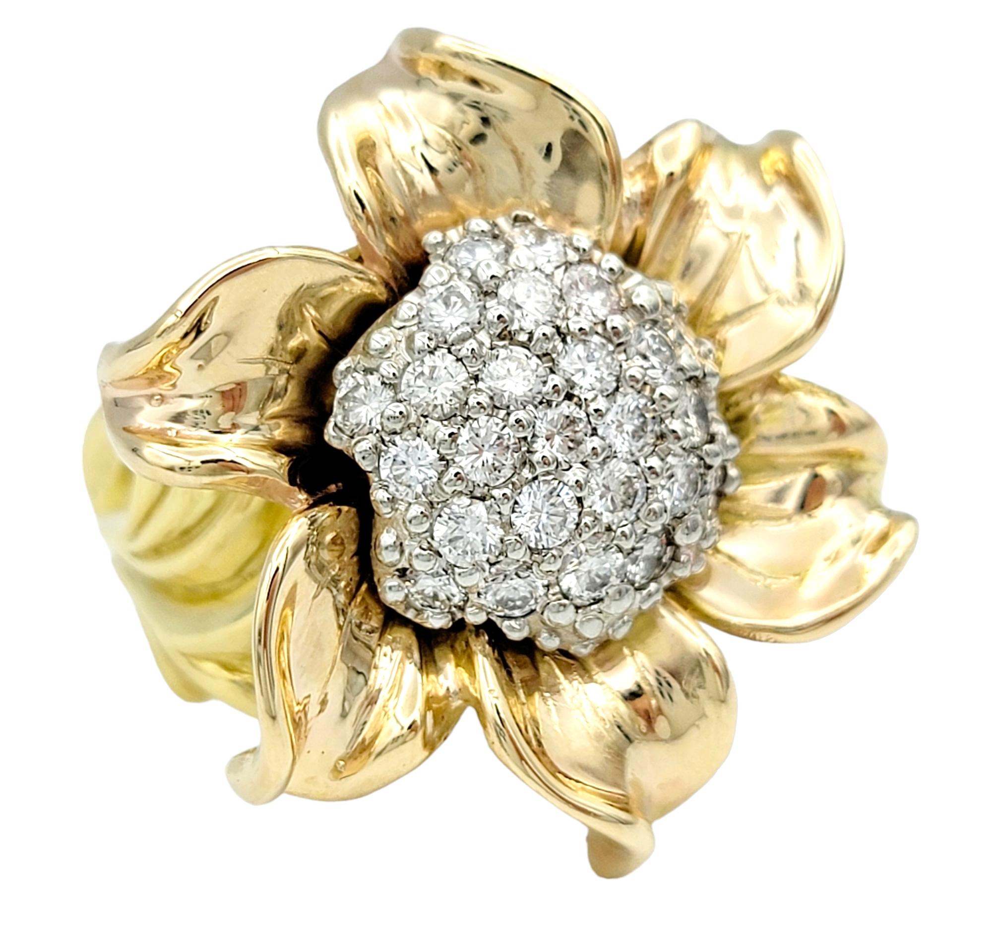Ring size: 6.75

This captivating statement ring is a magnificent ode to the beauty and intricacies of nature. Crafted with a bold and asymmetrical design, it takes the form of a sunflower, one of nature's most iconic symbols. The sunflower's