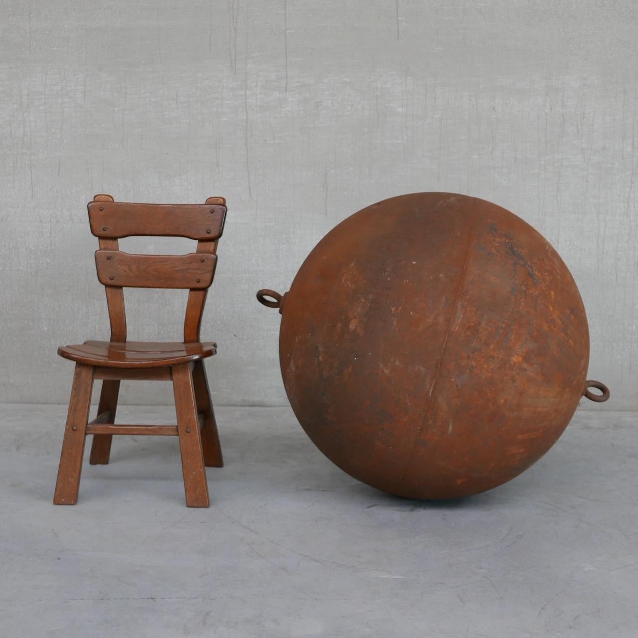 A huge metre wide metal circular ball likely to be a buoy or the like. 

Hard to age but likely France, c1920s. 

Great condition with an amazing patina. 

Each end has a hanging ring.

Location: Belgium Gallery. 

Dimensions: 110 height x