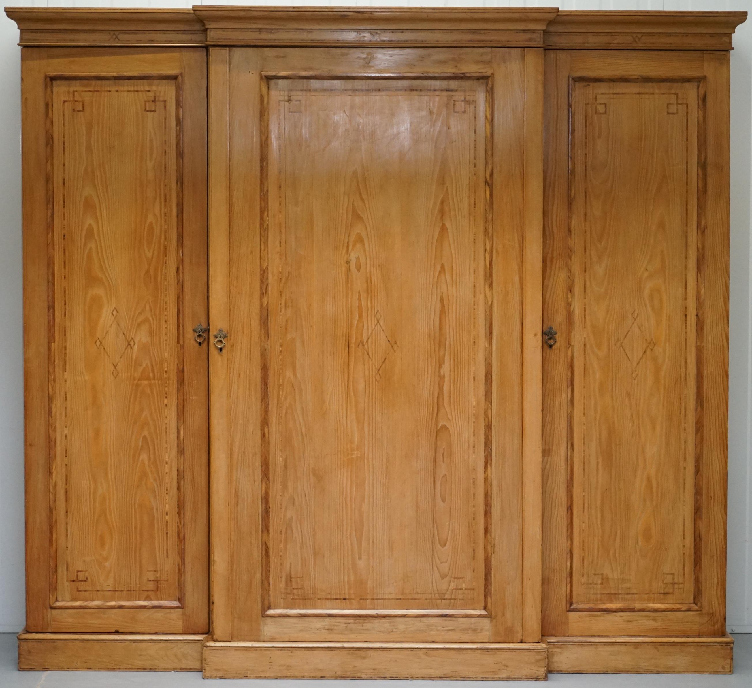 We are delighted to offer for sale this exquisite very large Victorian breakfront solid pine with walnut and oak inlay detailing wardrobe including a chest of drawers and linen shelves 

Where to begin! This piece is absolutely stunning, the first