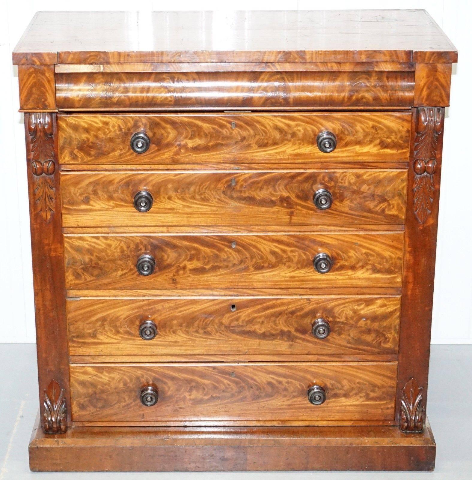 We are delighted to offer for sale this stunning very large flamed mahogany chest of drawers

A very grand and well-made piece, the flamed mahogany cuts are absolutely stunning, if gorgeous timber patina is your thing then these are the drawers