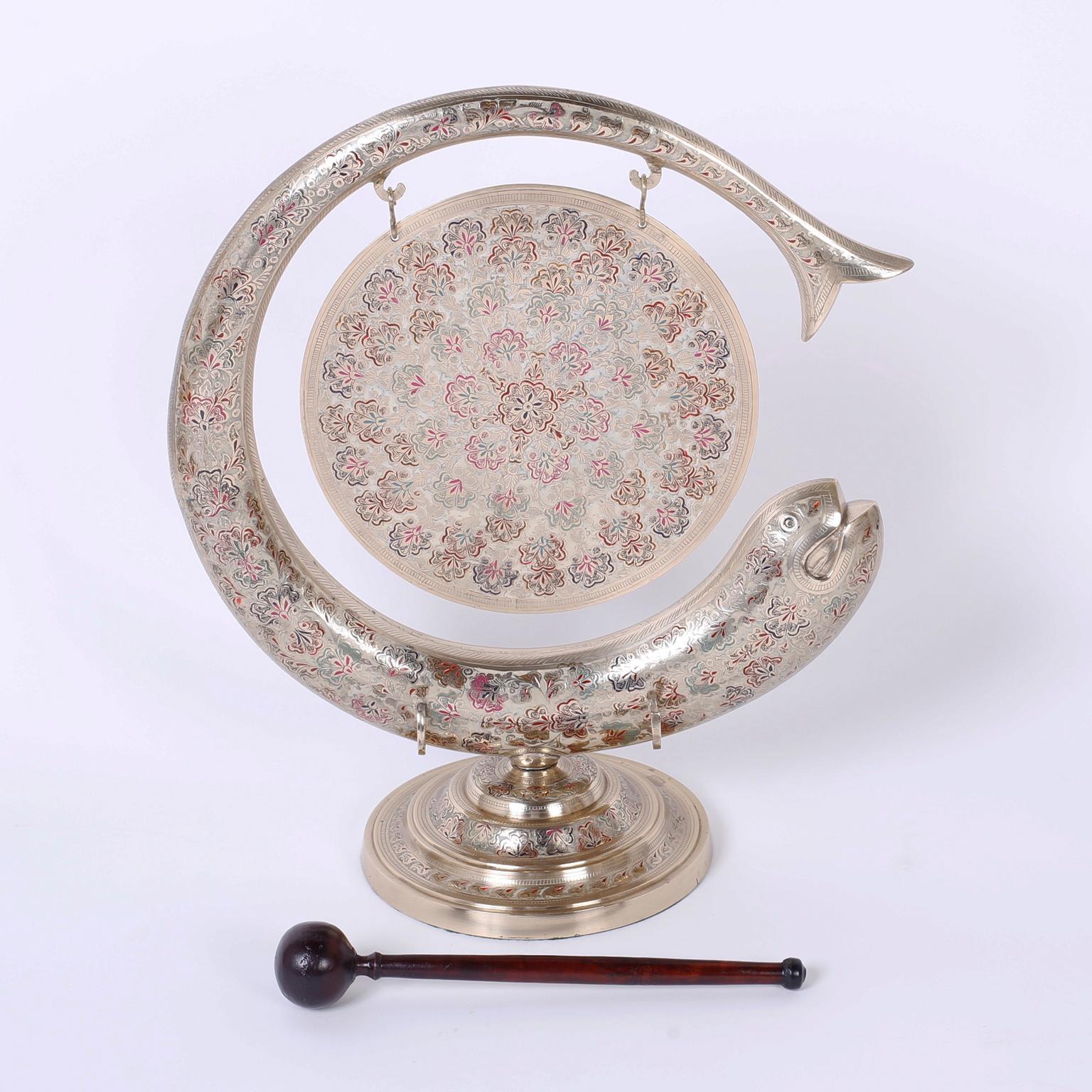 Vintage Anglo Indian dinner gong with a wooden mallet, crafted in brass with lovely enamel paintings on hand engraved floral designs over an inspired fish motif set on a Classic turned stand.
 