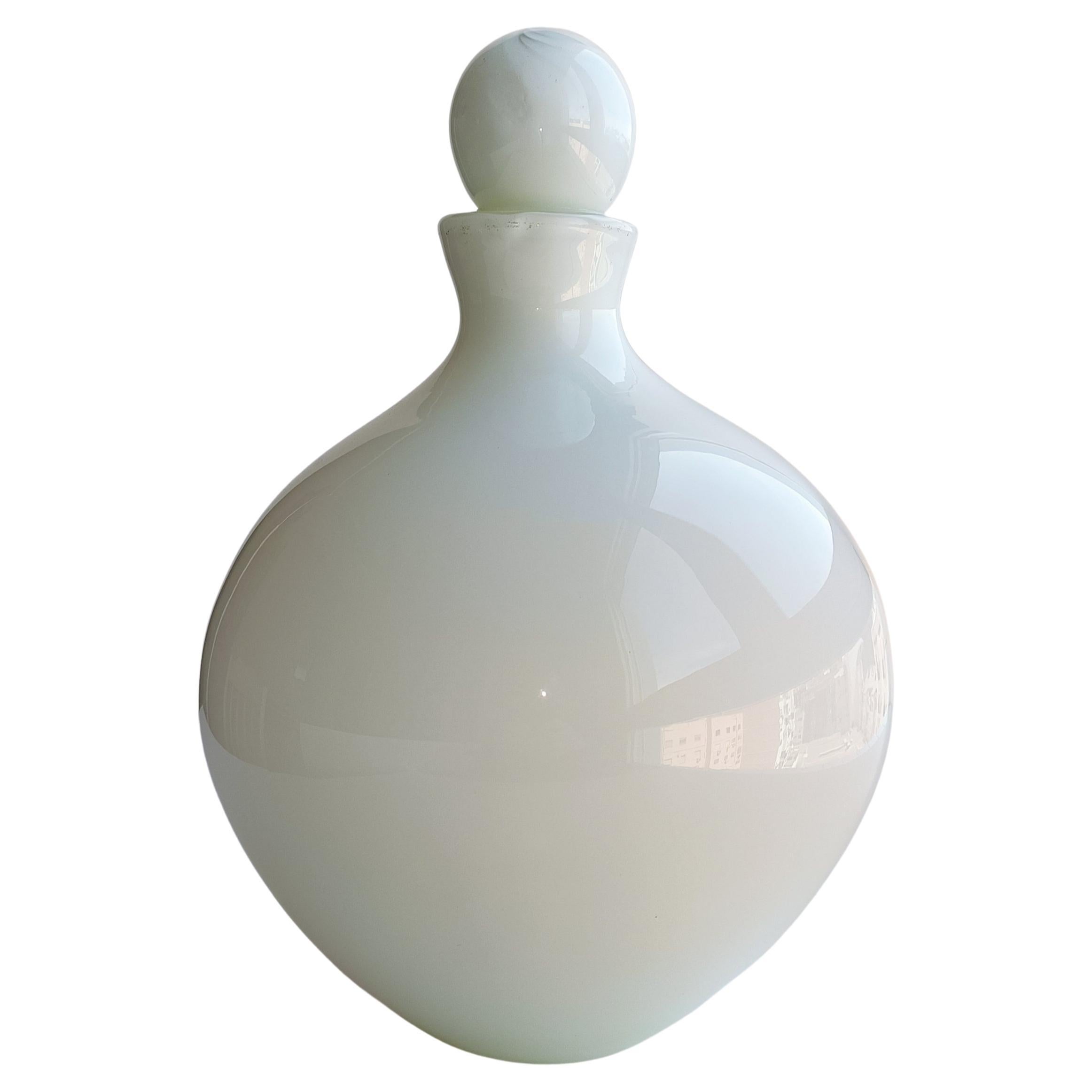 A stunning Mid Century French style Murano glass huge bottle in a pearl white color with a fabulous volume and design line, attributed to Formia Murano, the prestigious Italian Murano glass house. Hand-blown in Venice, Italy, circa the Mid Century