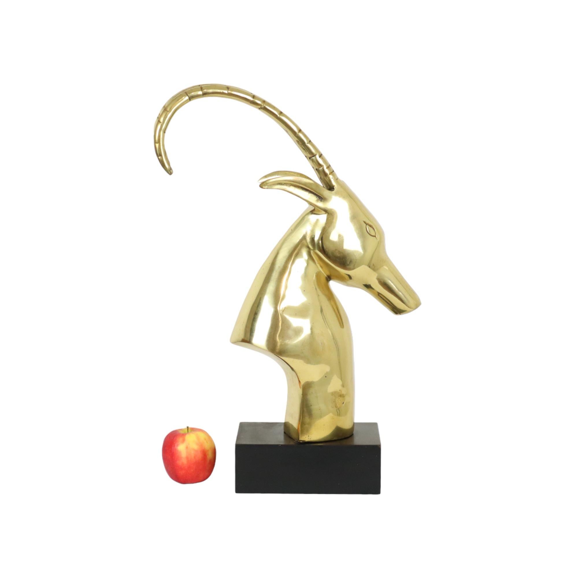 Vintage ibex, gazelle or ram head, copper sculpture in the style of Leon Francois Chervet, the famous designer of the 'Rams Head' table, not marked or signed, 1960s, France.

Beautiful high quality brass statue on a rectangular black lacquered
