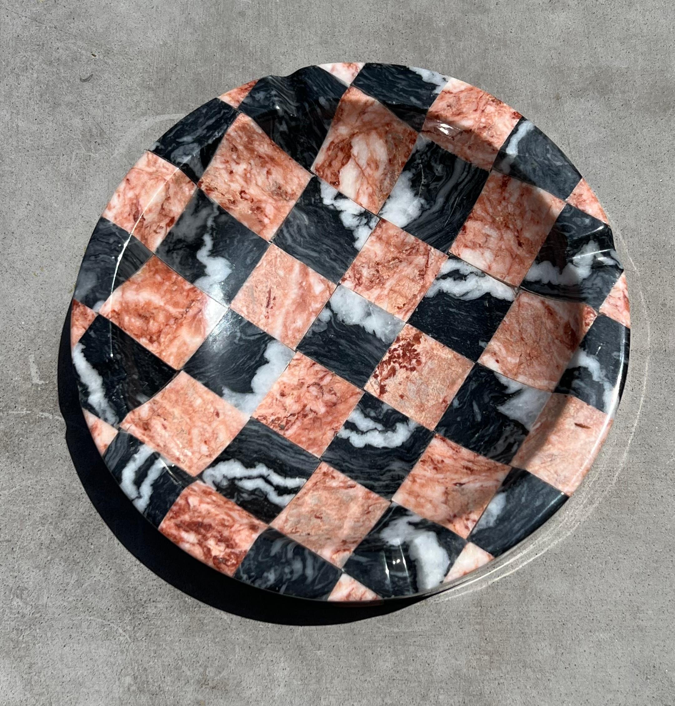 An ultra rare vintage Italian checkered marble ashtray in tones of rose, ash, peony, and graphite. Very large - 8 inches in diameter. Thick chunky edge with rivulets to hold your cigarette or palo santo, incense or what have you. This piece could of